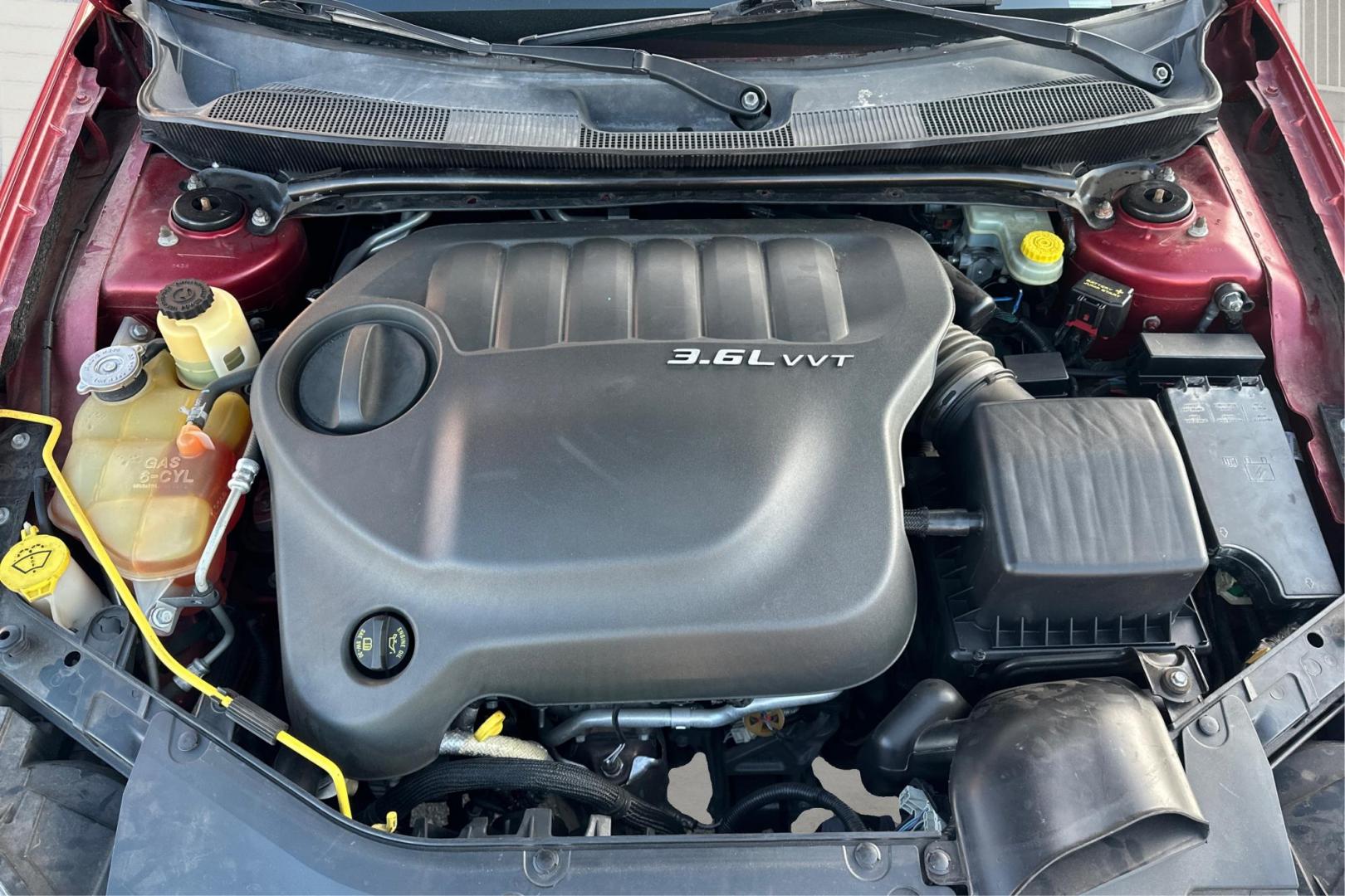 2012 Purple Chrysler 200 Touring (1C3CCBBG2CN) with an 3.6L V6 DOHC 24V FFV engine, 6-Speed Automatic transmission, located at 344 S Washington Blvd, Ogden, UT, 84404, (801) 399-1799, 41.255482, -111.970848 - Photo#10