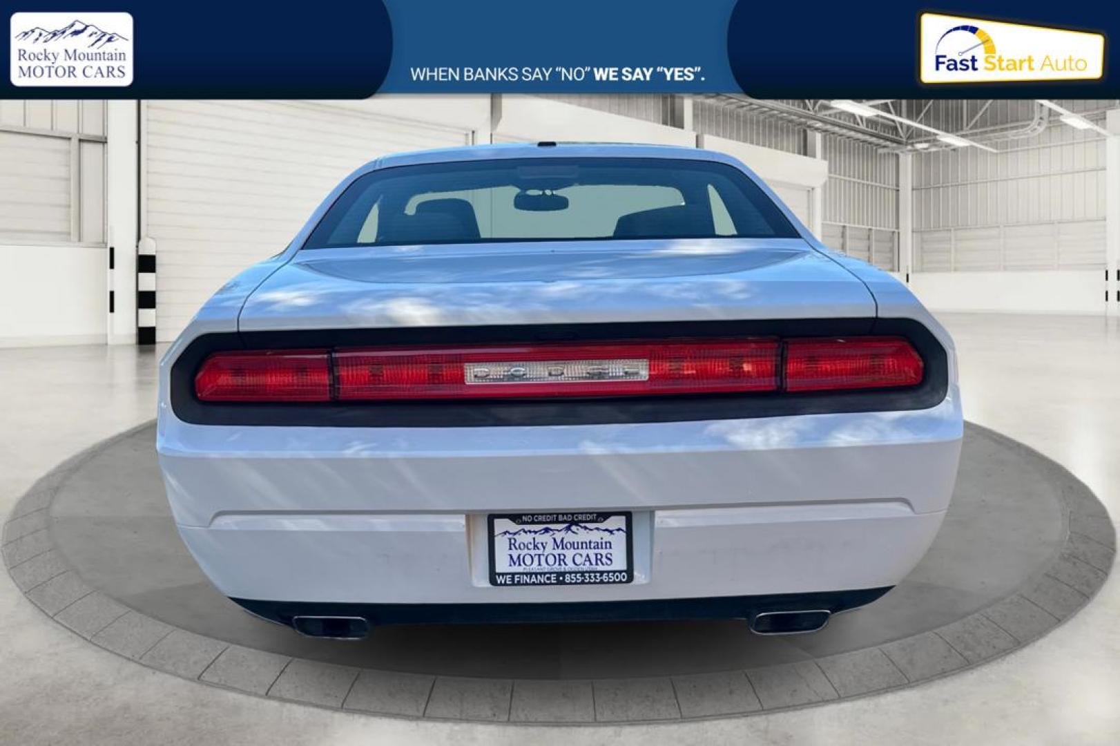 2012 White Dodge Challenger SXT (2C3CDYAG7CH) with an 3.6L V6 DOHC 24V engine, 4-Speed Automatic transmission, located at 767 S State Road, Pleasant Grove, UT, 84062, (801) 785-1058, 40.354839, -111.736687 - Photo#3