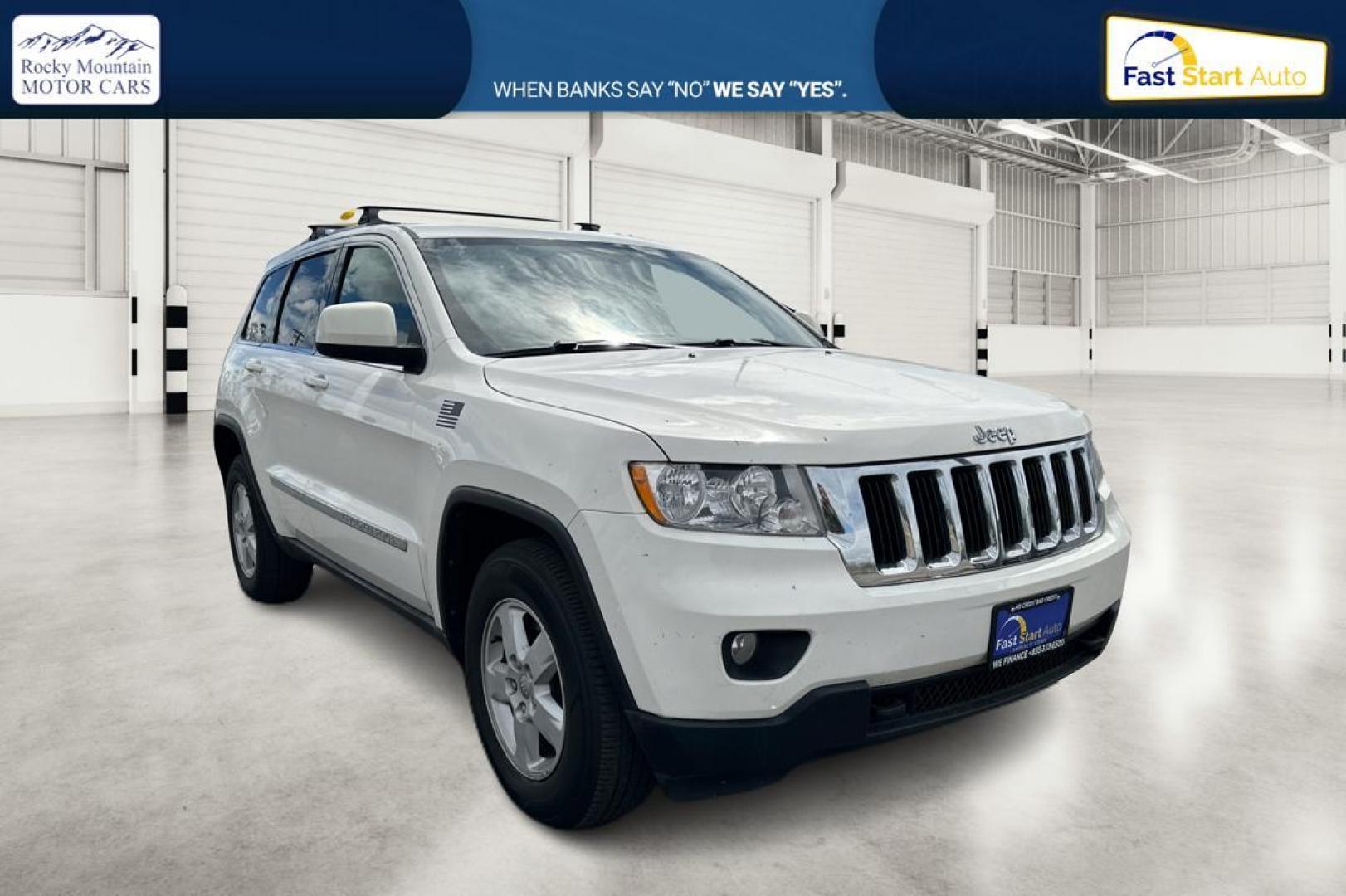 2012 White Jeep Grand Cherokee Laredo 4WD (1C4RJFAG7CC) with an 3.6L V6 DOHC 24V engine, 5-Speed Automatic transmission, located at 344 S Washington Blvd, Ogden, UT, 84404, (801) 399-1799, 41.255482, -111.970848 - Photo#0
