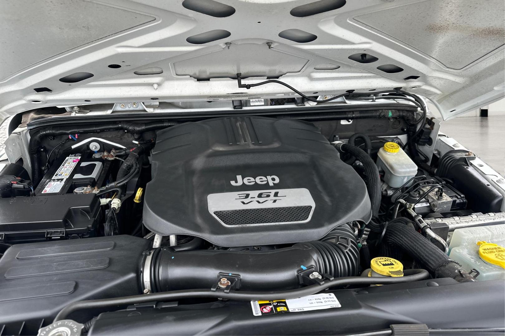 2012 White Jeep Wrangler Sport 4WD (1C4AJWAG0CL) with an 3.6L V6 DOHC 24V FFV engine, Automatic, 5-Spd transmission, located at 344 S Washington Blvd, Ogden, UT, 84404, (801) 399-1799, 41.255482, -111.970848 - Photo#10