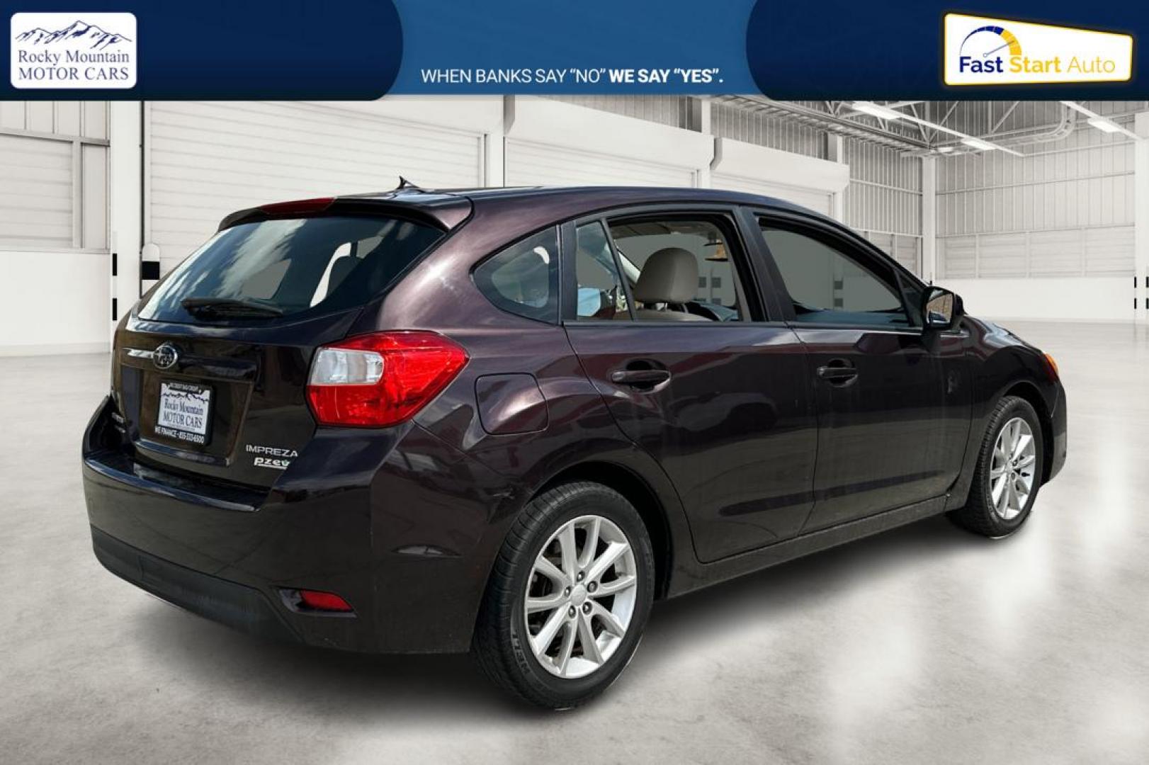 2012 Purple Subaru Impreza Premium 5-Door (JF1GPAB69CG) with an 2.0L H4 DOHC 16V engine, Continuously Variable Transmission transmission, located at 767 S State Road, Pleasant Grove, UT, 84062, (801) 785-1058, 40.354839, -111.736687 - Photo#2