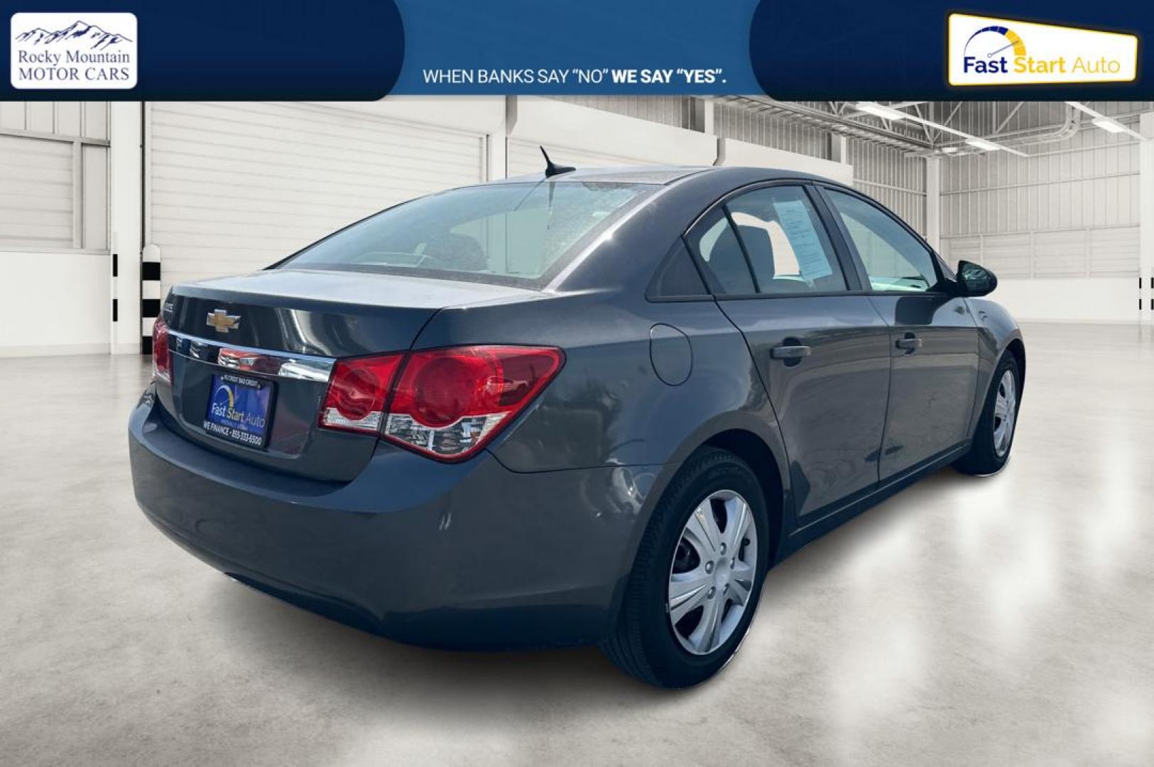 2013 Gray Chevrolet Cruze LS Auto (1G1PA5SGXD7) with an 1.8L L4 DOHC 16V engine, 6-Speed Automatic transmission, located at 344 S Washington Blvd, Ogden, UT, 84404, (801) 399-1799, 41.255482, -111.970848 - Photo#2