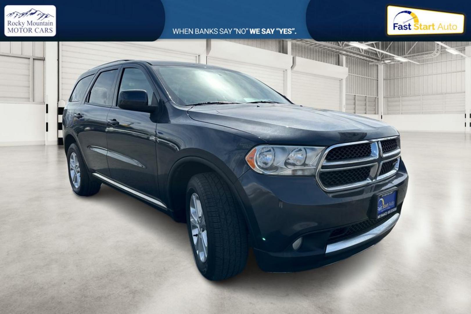 2013 Gray Dodge Durango SXT RWD (1C4RDHAG8DC) with an 3.6L V6 DOHC 24V engine, 5-Speed Automatic transmission, located at 767 S State Road, Pleasant Grove, UT, 84062, (801) 785-1058, 40.354839, -111.736687 - Photo#0