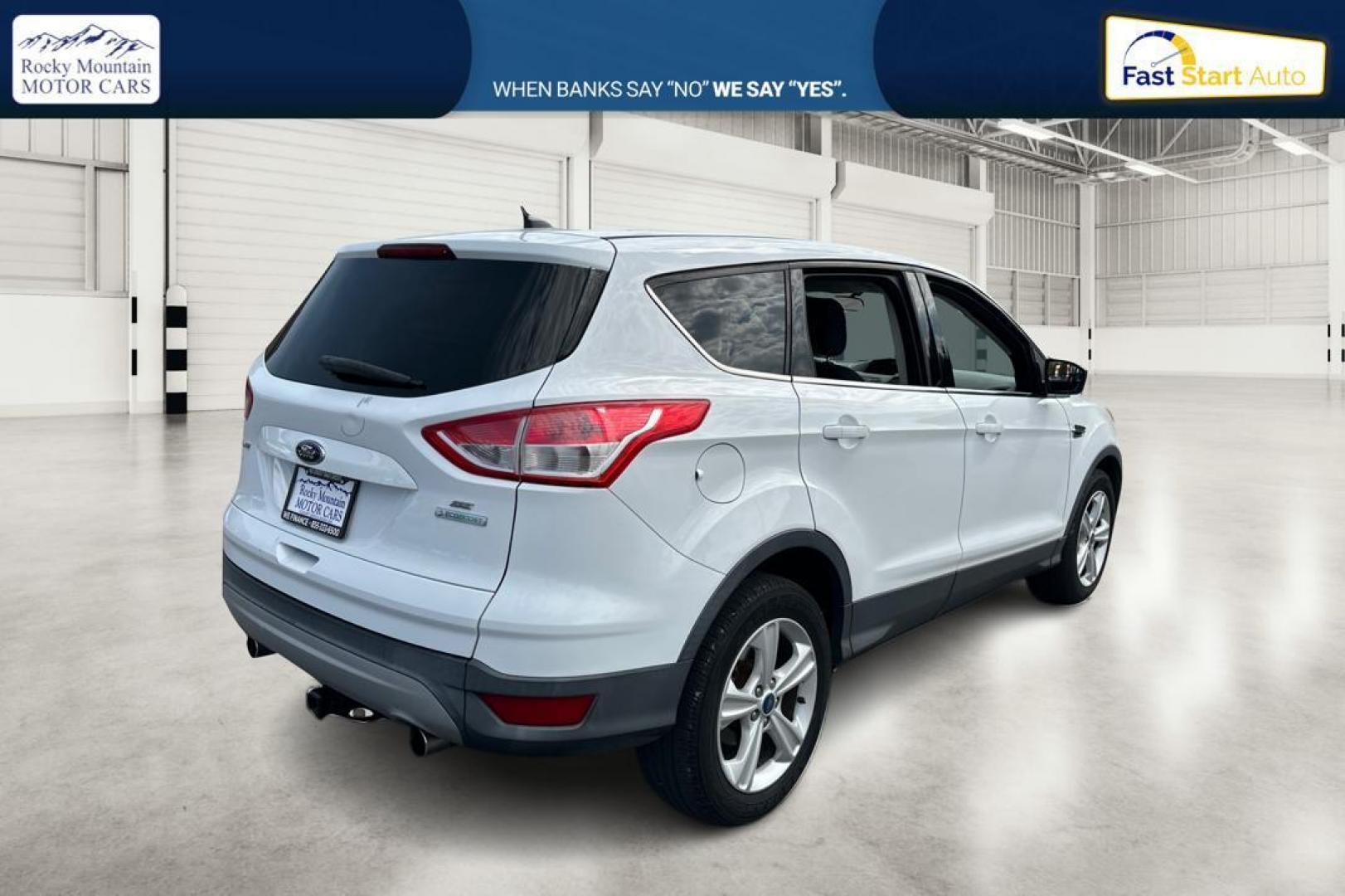 2013 White Ford Escape SE FWD (1FMCU0GX0DU) with an 1.6L L4 DOHC 16V engine, 6-Speed Automatic transmission, located at 7755 State Street, Midvale, UT, 84047, (801) 753-9063, 40.610329, -111.890656 - Photo#2