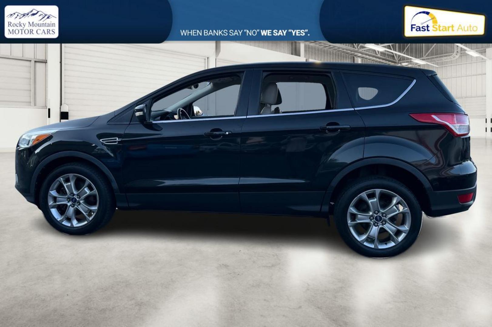 2013 Black Ford Escape SEL 4WD (1FMCU9H91DU) with an 2.0L L4 DOHC 16V engine, 6-Speed Automatic transmission, located at 7755 State Street, Midvale, UT, 84047, (801) 753-9063, 40.610329, -111.890656 - Photo#5