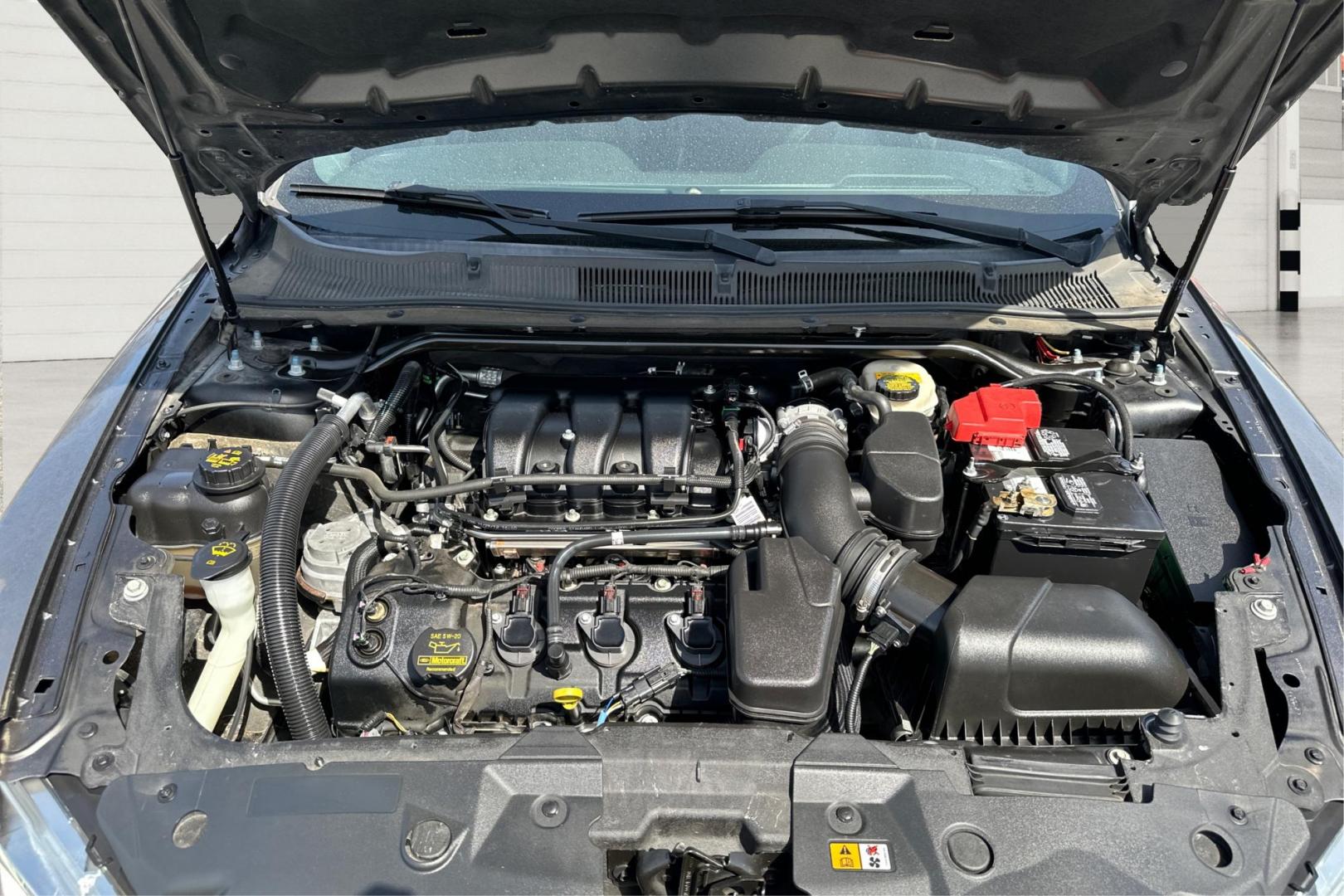 2013 Gray Ford Taurus SEL FWD (1FAHP2E87DG) with an 3.5L V6 DOHC 24V engine, 6-Speed Automatic transmission, located at 7755 State Street, Midvale, UT, 84047, (801) 753-9063, 40.610329, -111.890656 - Photo#10