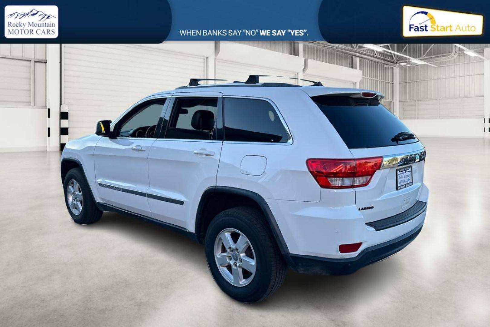 2013 White Jeep Grand Cherokee Laredo 2WD (1C4RJEAG6DC) with an 3.6L V6 DOHC 24V engine, 5-Speed Automatic transmission, located at 7755 State Street, Midvale, UT, 84047, (801) 753-9063, 40.610329, -111.890656 - Photo#5