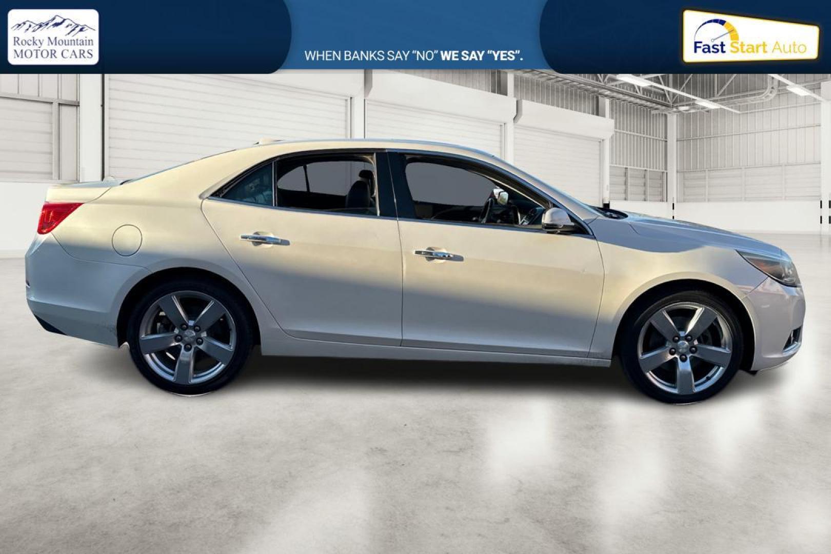 2014 White Chevrolet Malibu 2LZ (1G11J5SX5EF) with an 2.0L L4 DOHC 16V engine, 6-Speed Automatic transmission, located at 344 S Washington Blvd, Ogden, UT, 84404, (801) 399-1799, 41.255482, -111.970848 - Photo#0
