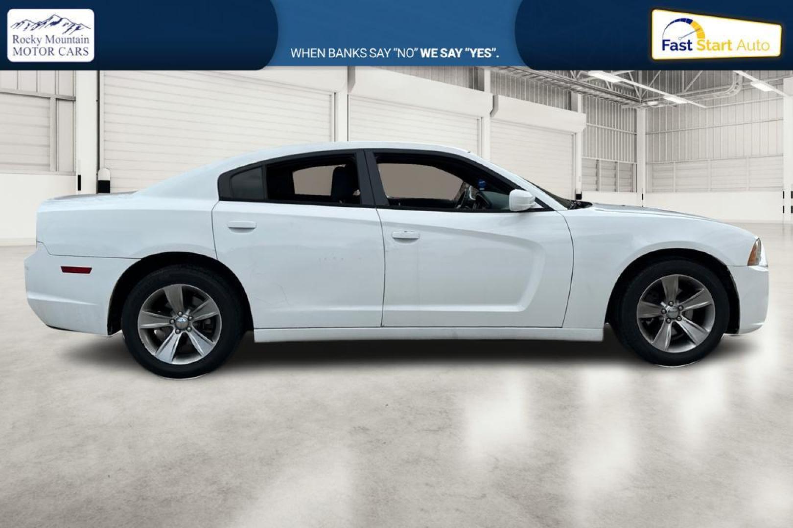 2014 White Dodge Charger SE (2C3CDXBG4EH) with an 3.6L V6 DOHC 24V engine, 5-Speed Automatic transmission, located at 7755 State Street, Midvale, UT, 84047, (801) 753-9063, 40.610329, -111.890656 - Photo#1