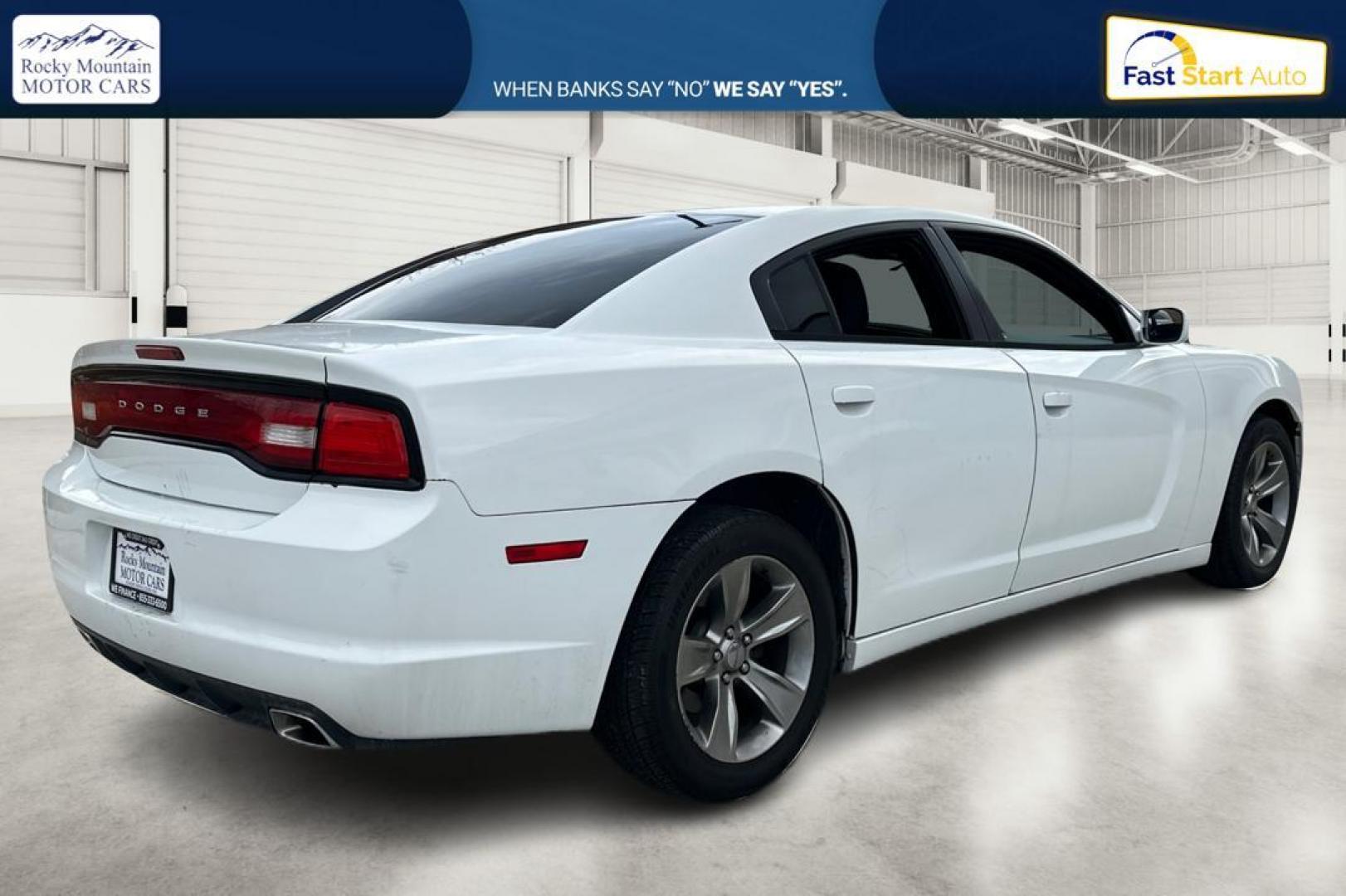 2014 White Dodge Charger SE (2C3CDXBG4EH) with an 3.6L V6 DOHC 24V engine, 5-Speed Automatic transmission, located at 7755 State Street, Midvale, UT, 84047, (801) 753-9063, 40.610329, -111.890656 - Photo#2