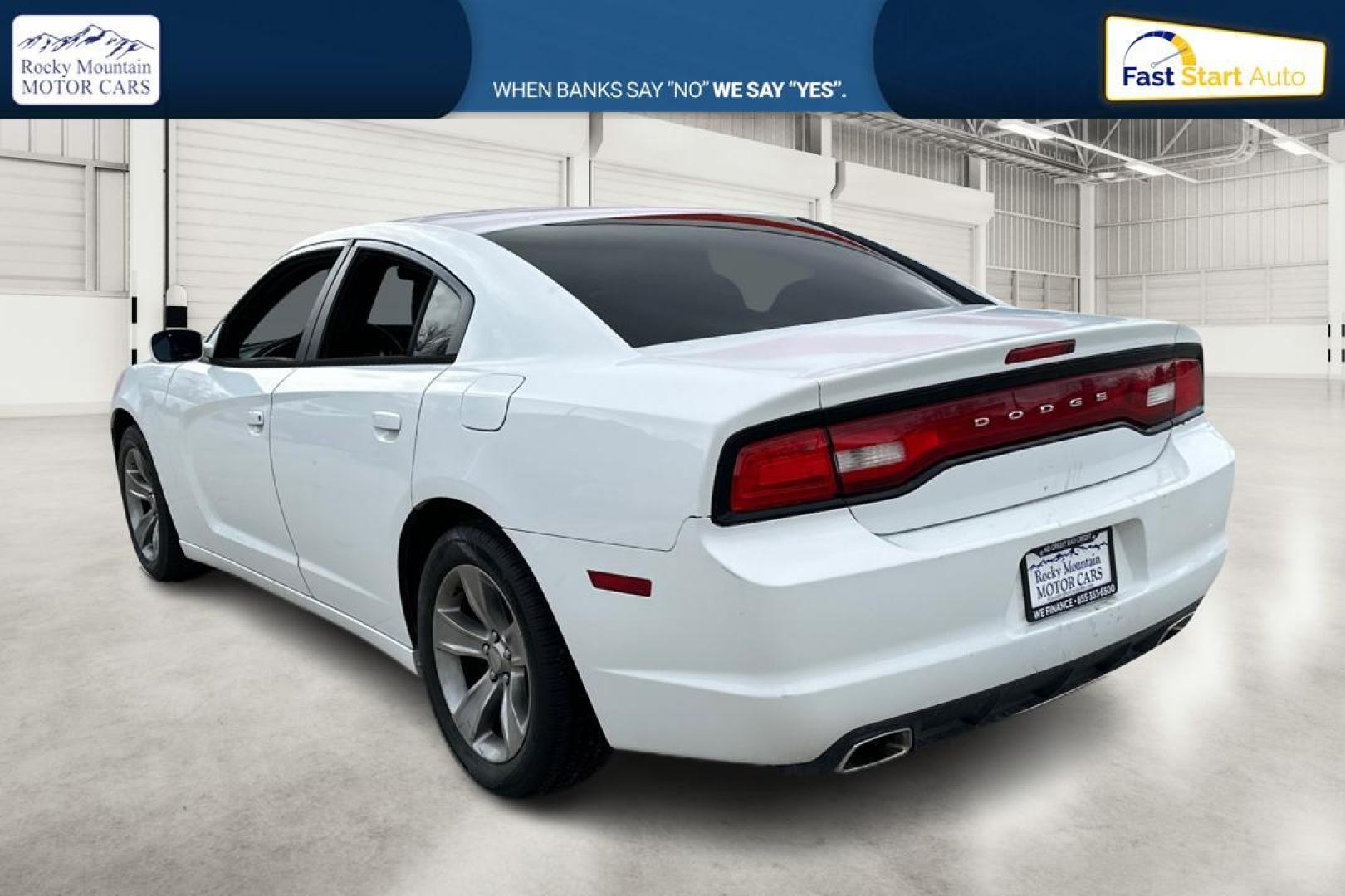 2014 White Dodge Charger SE (2C3CDXBG4EH) with an 3.6L V6 DOHC 24V engine, 5-Speed Automatic transmission, located at 7755 State Street, Midvale, UT, 84047, (801) 753-9063, 40.610329, -111.890656 - Photo#5