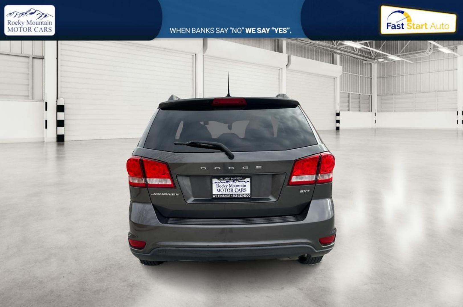 2014 Gray Dodge Journey SXT (3C4PDCBB6ET) with an 2.4L L6 DOHC 16V engine, 4-Speed Automatic transmission, located at 7755 State Street, Midvale, UT, 84047, (801) 753-9063, 40.610329, -111.890656 - Photo#4