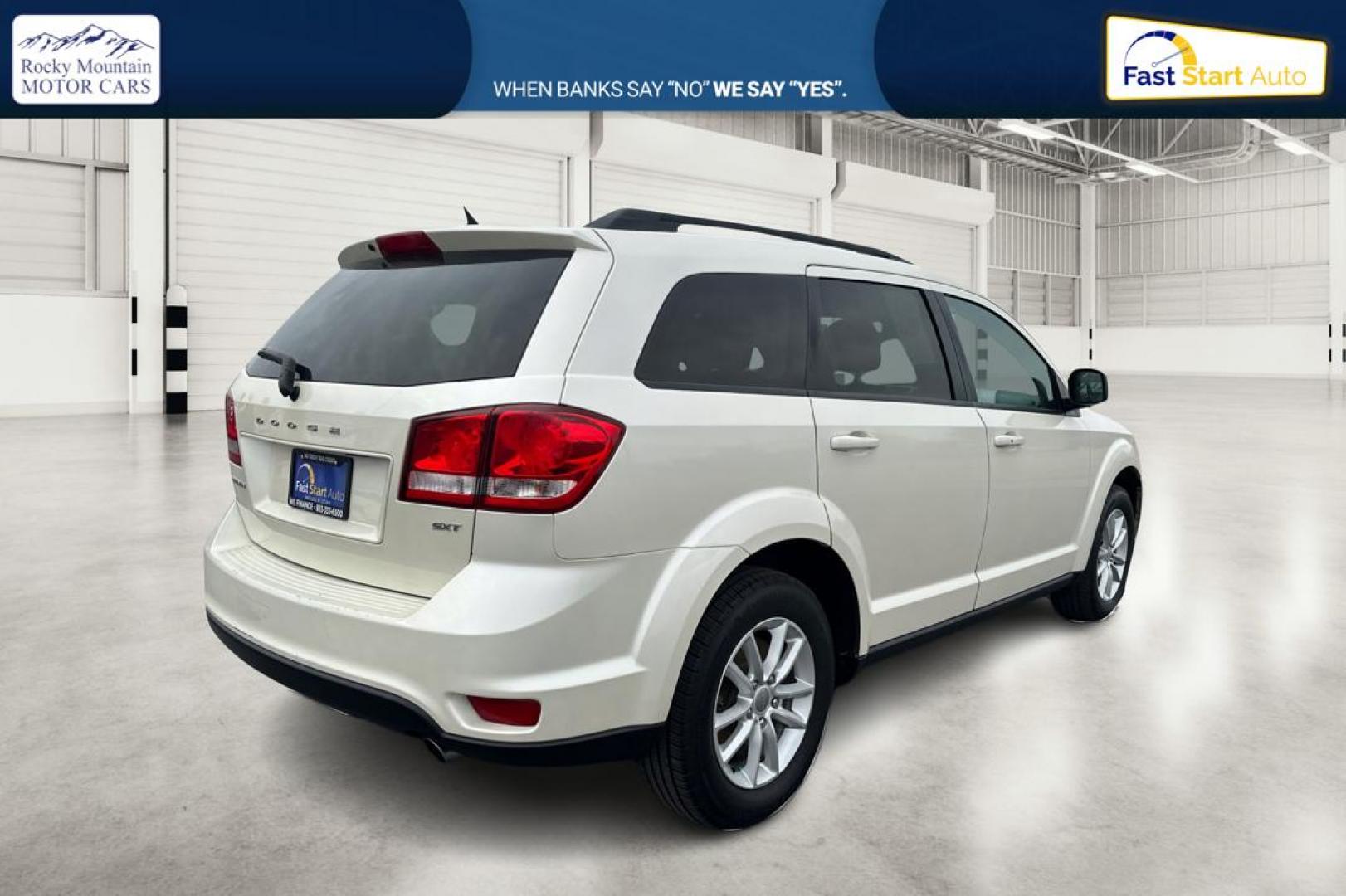 2014 White Dodge Journey SXT (3C4PDCBG2ET) with an 3.6L V6 DOHC 24V engine, 6-Speed Automatic transmission, located at 7755 State Street, Midvale, UT, 84047, (801) 753-9063, 40.610329, -111.890656 - Photo#2