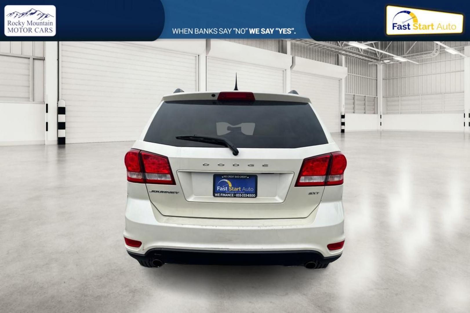2014 White Dodge Journey SXT (3C4PDCBG2ET) with an 3.6L V6 DOHC 24V engine, 6-Speed Automatic transmission, located at 7755 State Street, Midvale, UT, 84047, (801) 753-9063, 40.610329, -111.890656 - Photo#4