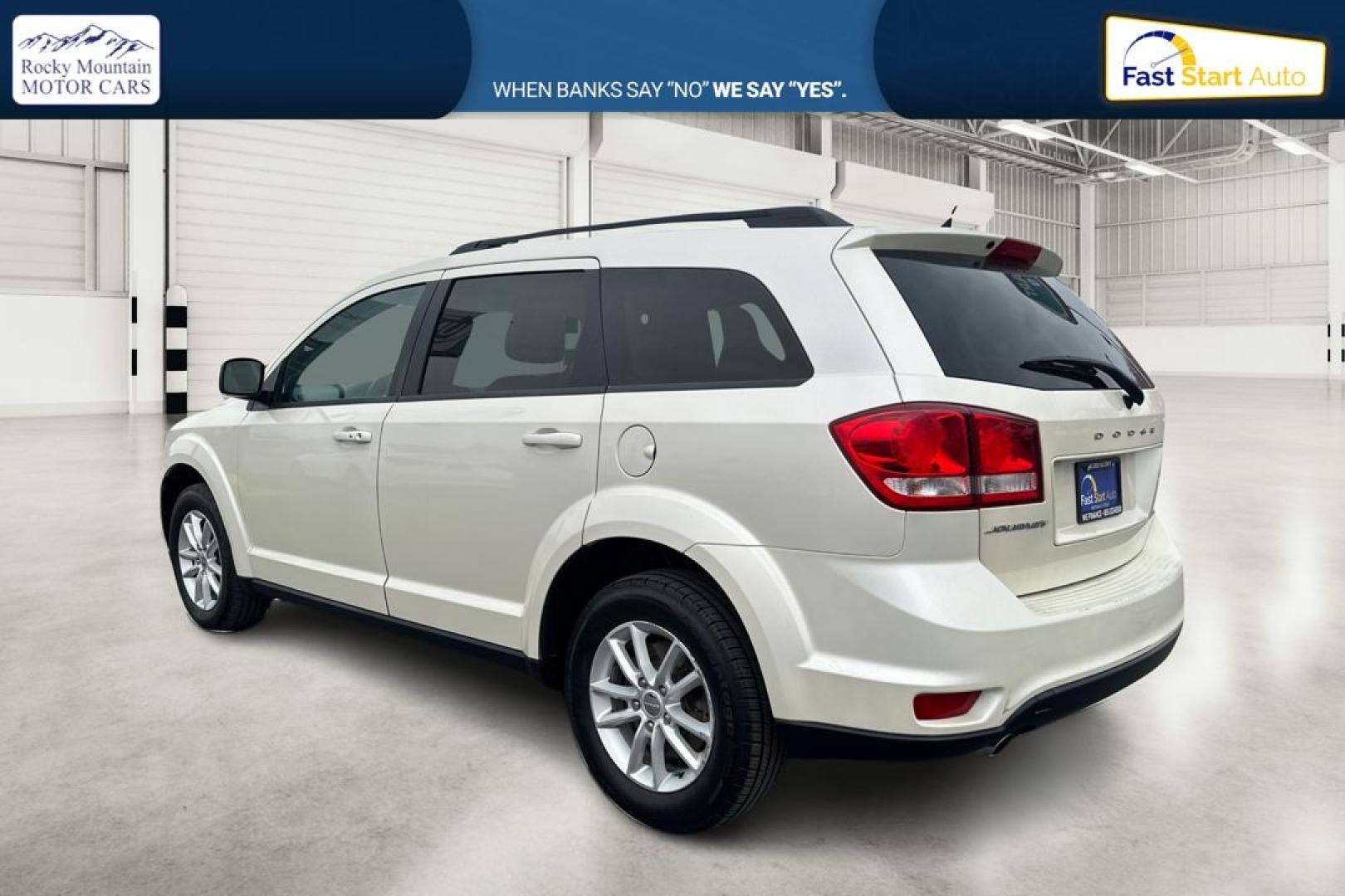 2014 White Dodge Journey SXT (3C4PDCBG2ET) with an 3.6L V6 DOHC 24V engine, 6-Speed Automatic transmission, located at 7755 State Street, Midvale, UT, 84047, (801) 753-9063, 40.610329, -111.890656 - Photo#5