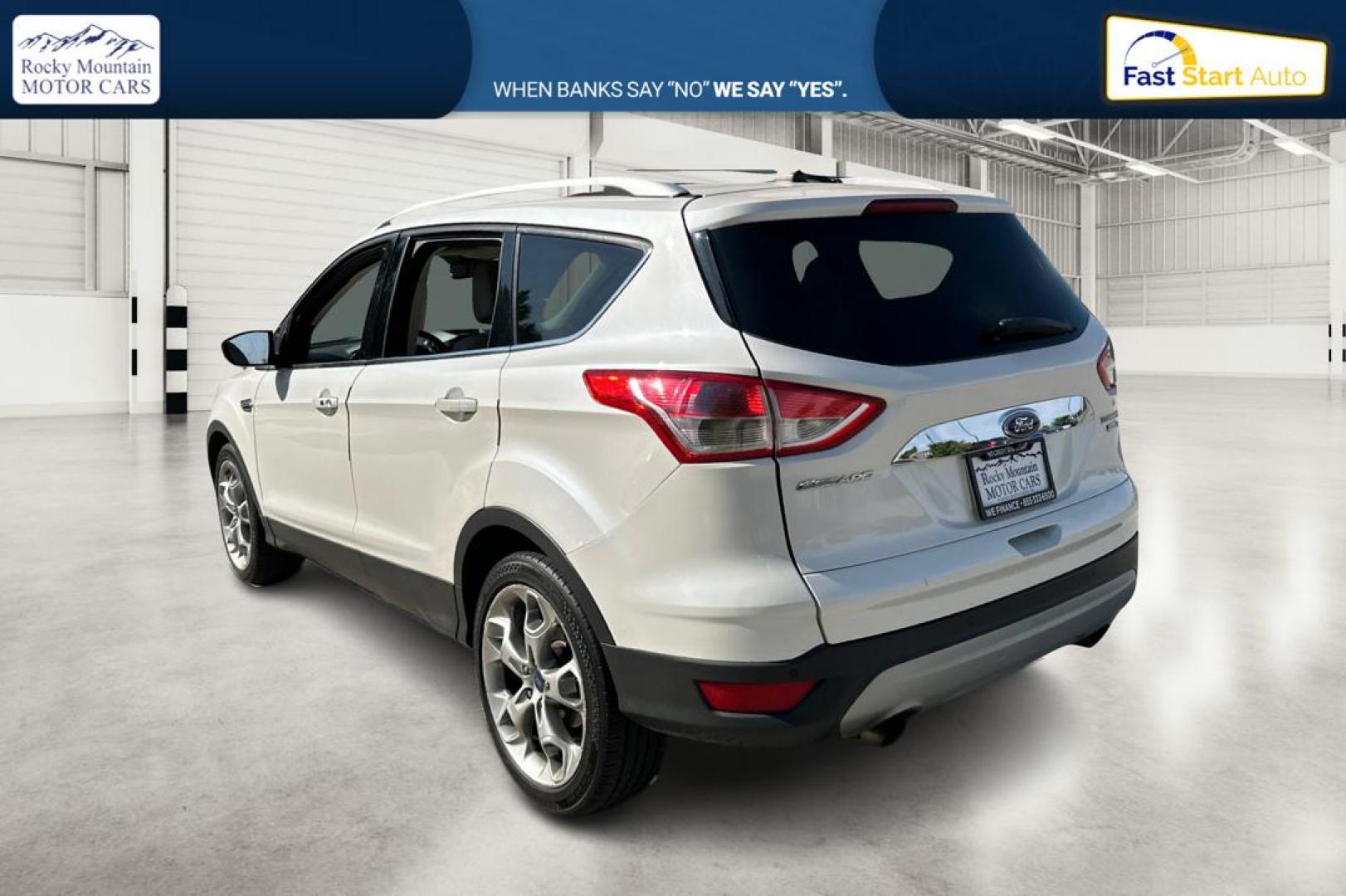 2014 White Ford Escape Titanium 4WD (1FMCU9J96EU) with an 2.0L L4 DOHC 16V engine, 6-Speed Automatic transmission, located at 767 S State Road, Pleasant Grove, UT, 84062, (801) 785-1058, 40.354839, -111.736687 - Photo#5