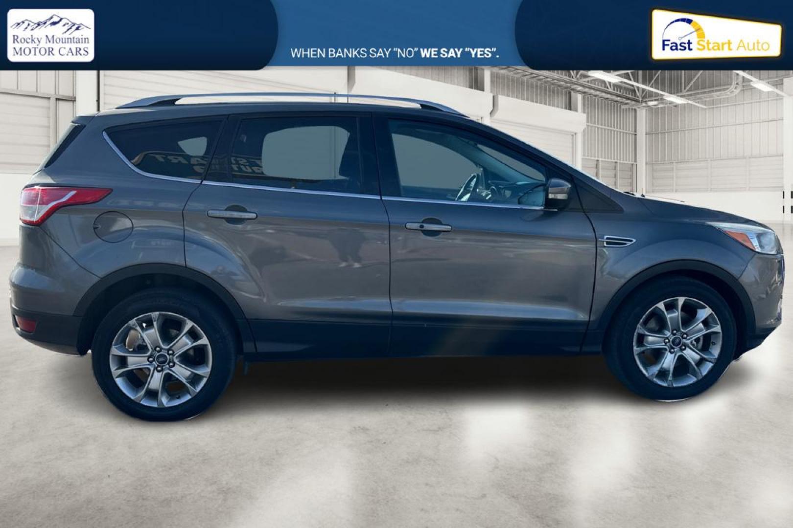2014 Gray Ford Escape Titanium FWD (1FMCU0J97EU) with an 2.0L L4 DOHC 16V engine, 6-Speed Automatic transmission, located at 7755 State Street, Midvale, UT, 84047, (801) 753-9063, 40.610329, -111.890656 - Photo#1