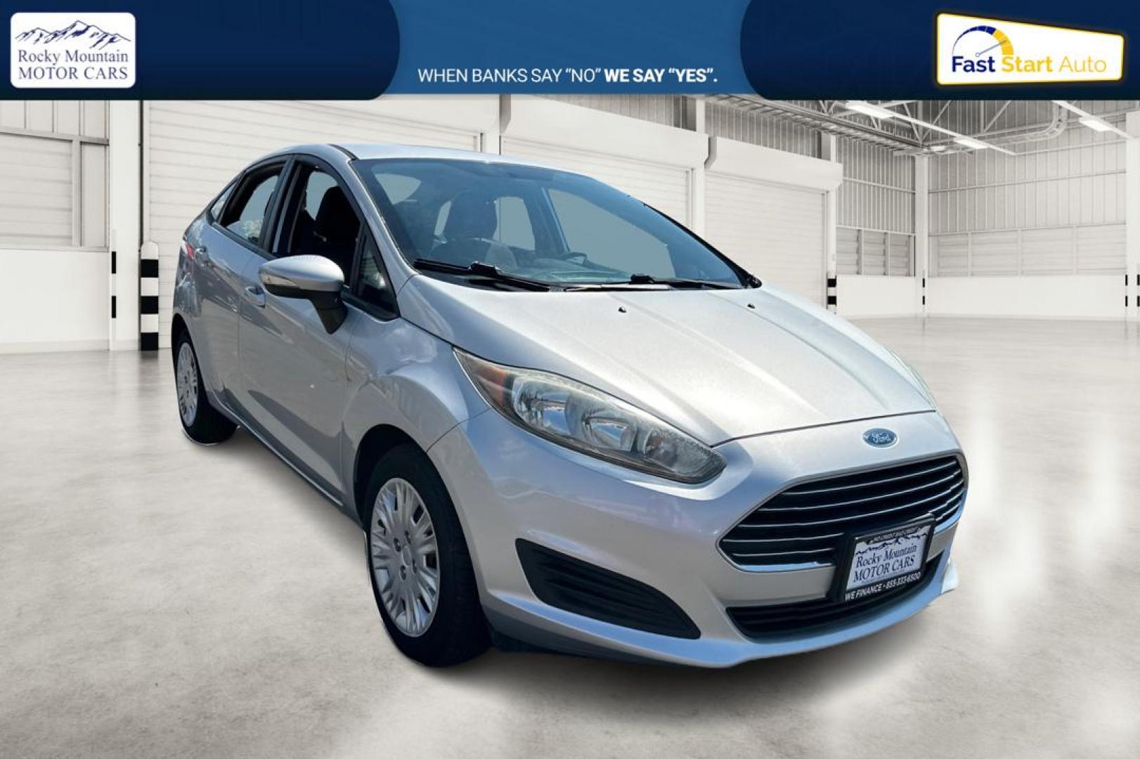 2014 Silver Ford Fiesta SE Sedan (3FADP4BJ8EM) with an 1.6L L4 DOHC 16V engine, Manual, 5-Spd transmission, located at 767 S State Road, Pleasant Grove, UT, 84062, (801) 785-1058, 40.354839, -111.736687 - Photo#0