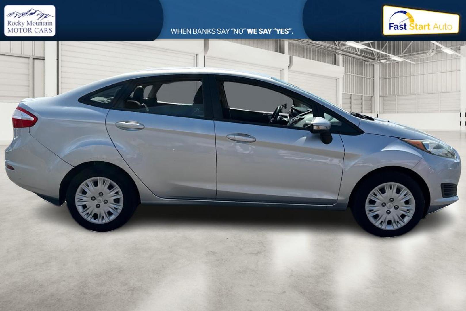 2014 Silver Ford Fiesta SE Sedan (3FADP4BJ8EM) with an 1.6L L4 DOHC 16V engine, Manual, 5-Spd transmission, located at 767 S State Road, Pleasant Grove, UT, 84062, (801) 785-1058, 40.354839, -111.736687 - Photo#1