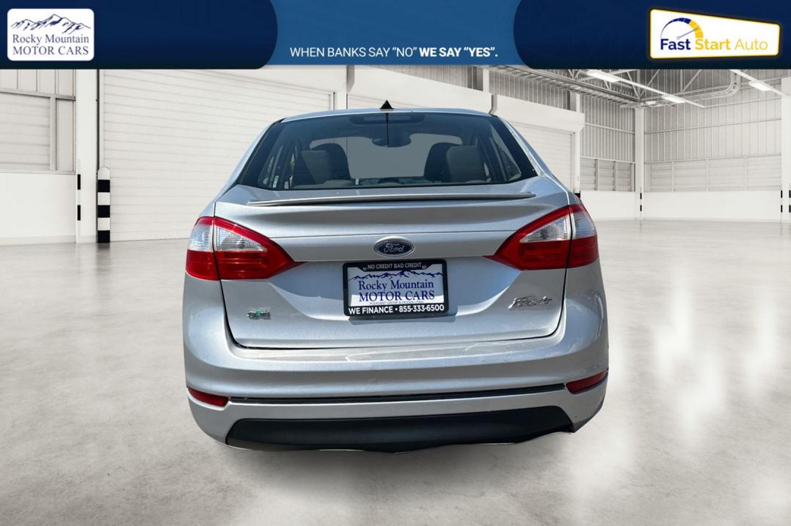 2014 Silver Ford Fiesta SE Sedan (3FADP4BJ8EM) with an 1.6L L4 DOHC 16V engine, Manual, 5-Spd transmission, located at 767 S State Road, Pleasant Grove, UT, 84062, (801) 785-1058, 40.354839, -111.736687 - Photo#4