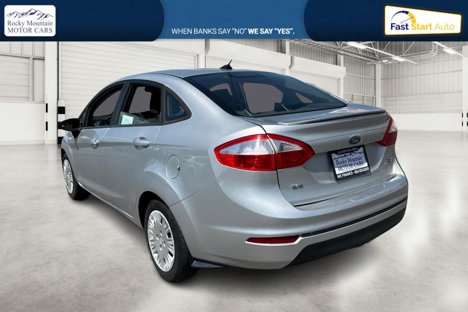 2014 Silver Ford Fiesta SE Sedan (3FADP4BJ8EM) with an 1.6L L4 DOHC 16V engine, Manual, 5-Spd transmission, located at 767 S State Road, Pleasant Grove, UT, 84062, (801) 785-1058, 40.354839, -111.736687 - Photo#5