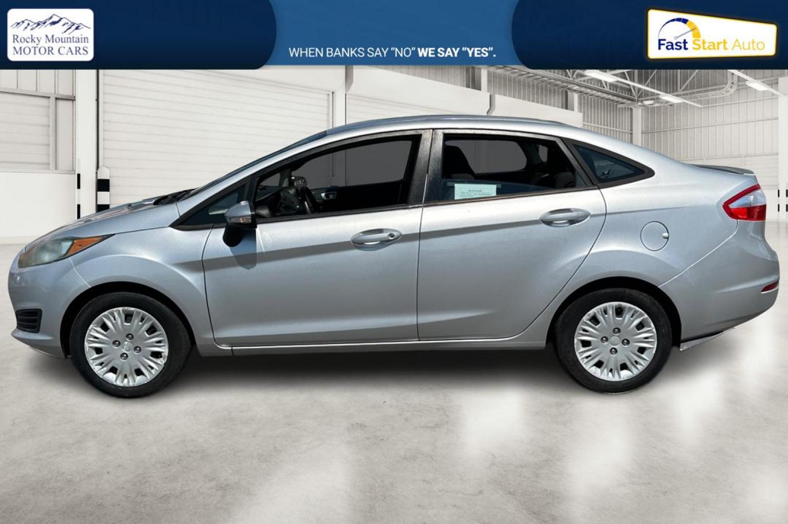 2014 Silver Ford Fiesta SE Sedan (3FADP4BJ8EM) with an 1.6L L4 DOHC 16V engine, Manual, 5-Spd transmission, located at 767 S State Road, Pleasant Grove, UT, 84062, (801) 785-1058, 40.354839, -111.736687 - Photo#6