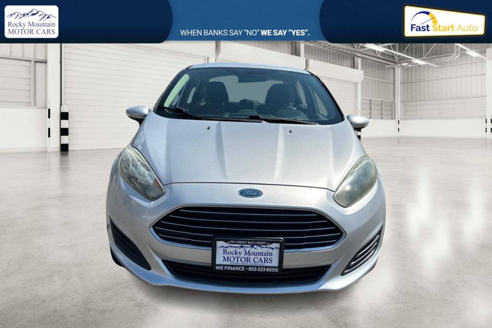 2014 Silver Ford Fiesta SE Sedan (3FADP4BJ8EM) with an 1.6L L4 DOHC 16V engine, Manual, 5-Spd transmission, located at 767 S State Road, Pleasant Grove, UT, 84062, (801) 785-1058, 40.354839, -111.736687 - Photo#9