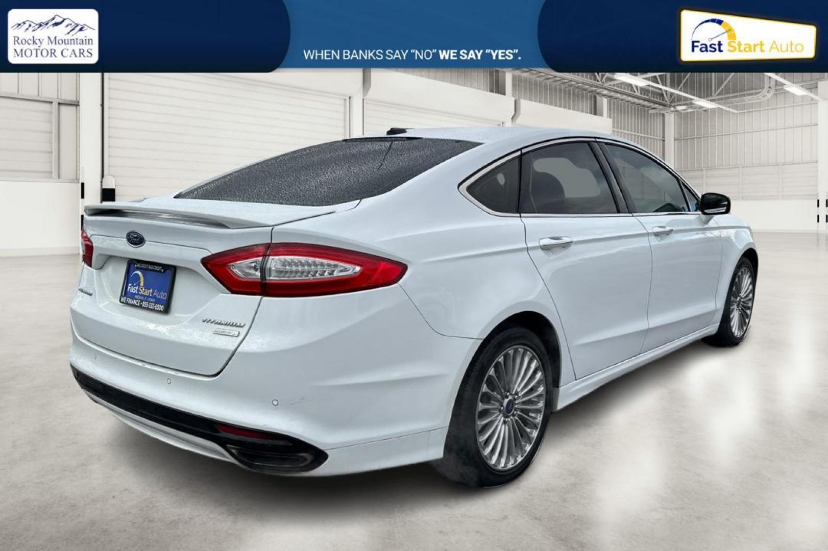 2014 White Ford Fusion Titanium (3FA6P0K93ER) with an 2.0L L4 DOHC 16V engine, Automatic, 6-Spd transmission, located at 7755 State Street, Midvale, UT, 84047, (801) 753-9063, 40.610329, -111.890656 - Photo#2