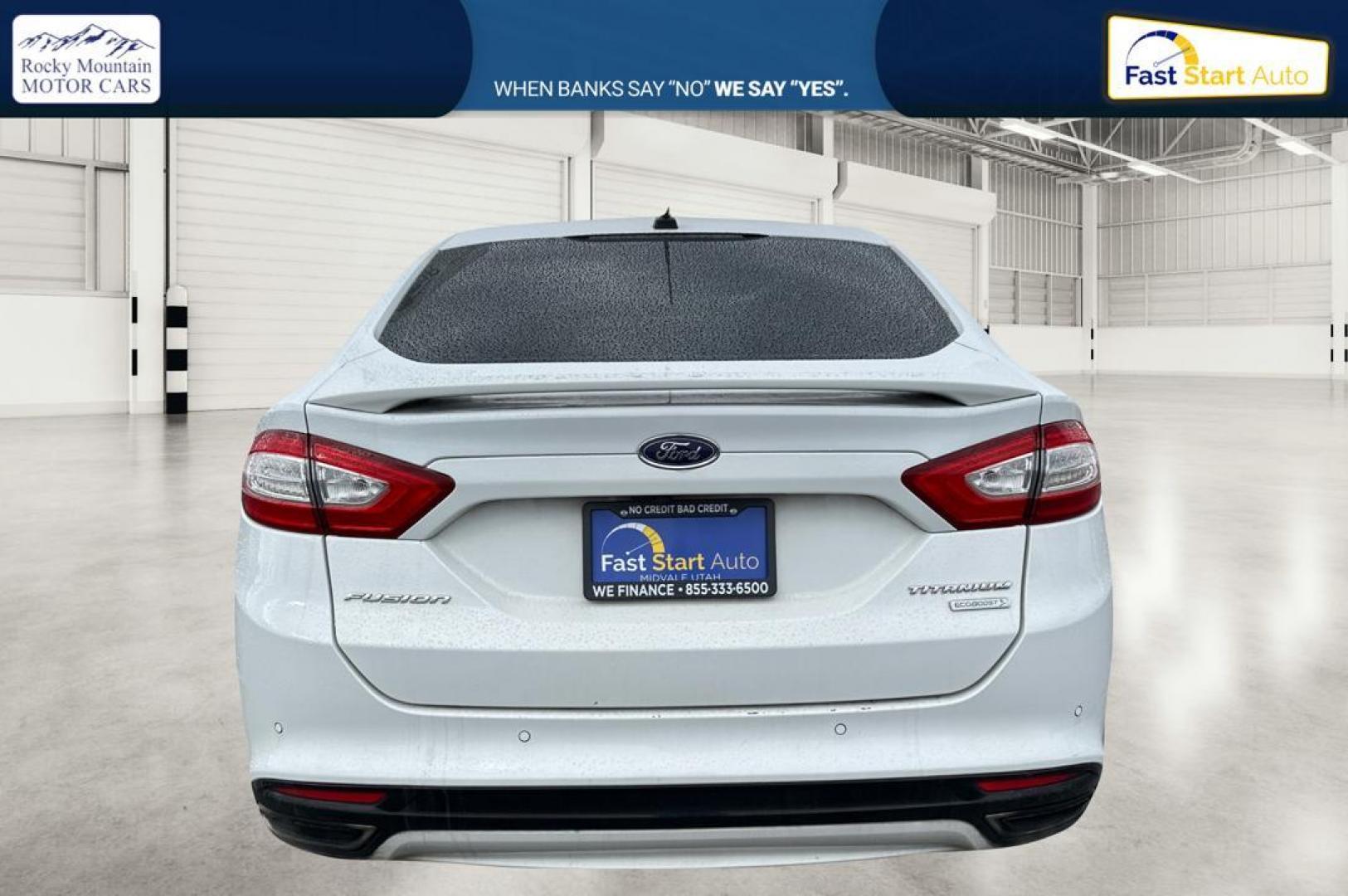 2014 White Ford Fusion Titanium (3FA6P0K93ER) with an 2.0L L4 DOHC 16V engine, Automatic, 6-Spd transmission, located at 7755 State Street, Midvale, UT, 84047, (801) 753-9063, 40.610329, -111.890656 - Photo#4