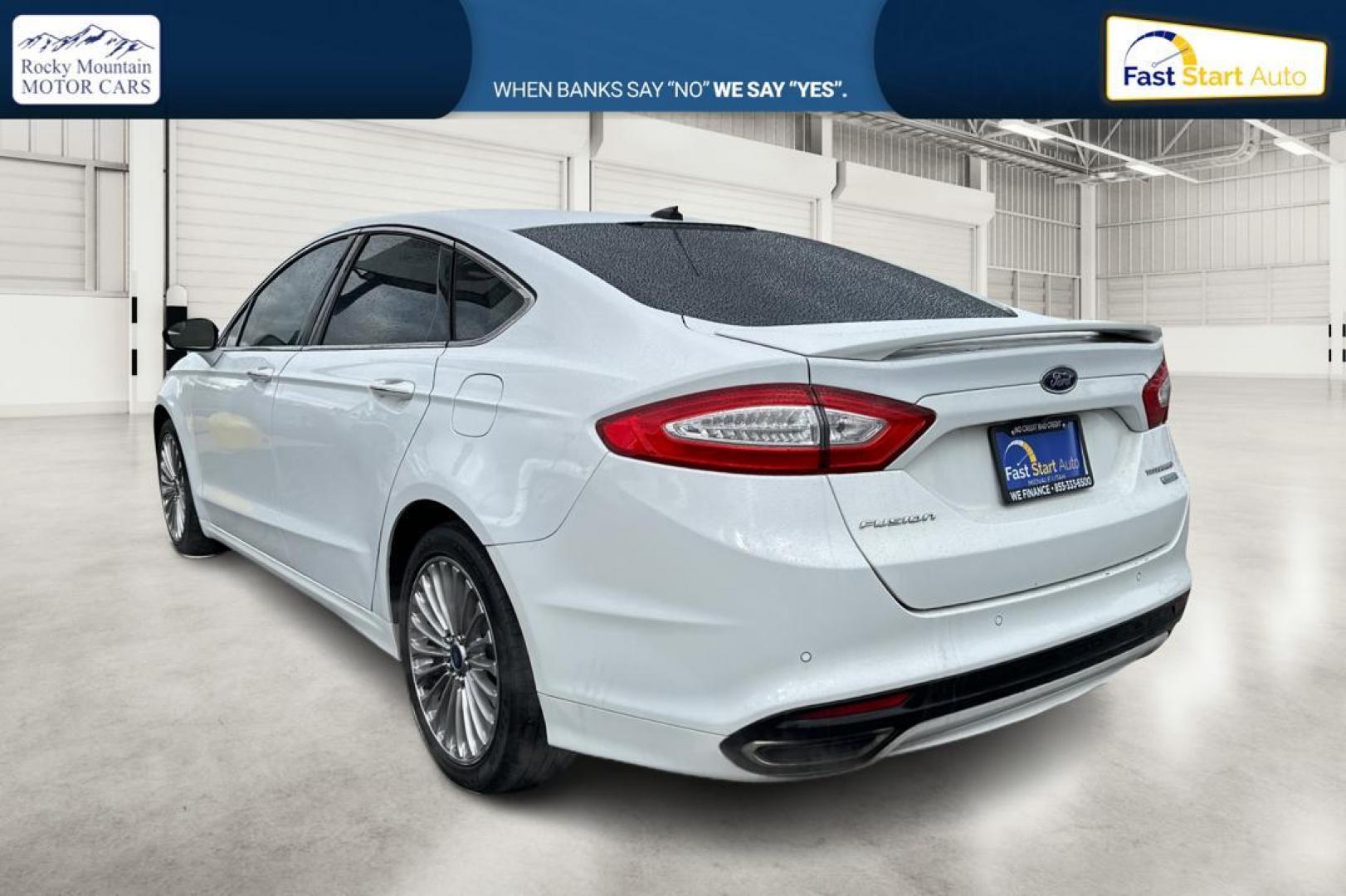 2014 White Ford Fusion Titanium (3FA6P0K93ER) with an 2.0L L4 DOHC 16V engine, Automatic, 6-Spd transmission, located at 7755 State Street, Midvale, UT, 84047, (801) 753-9063, 40.610329, -111.890656 - Photo#5