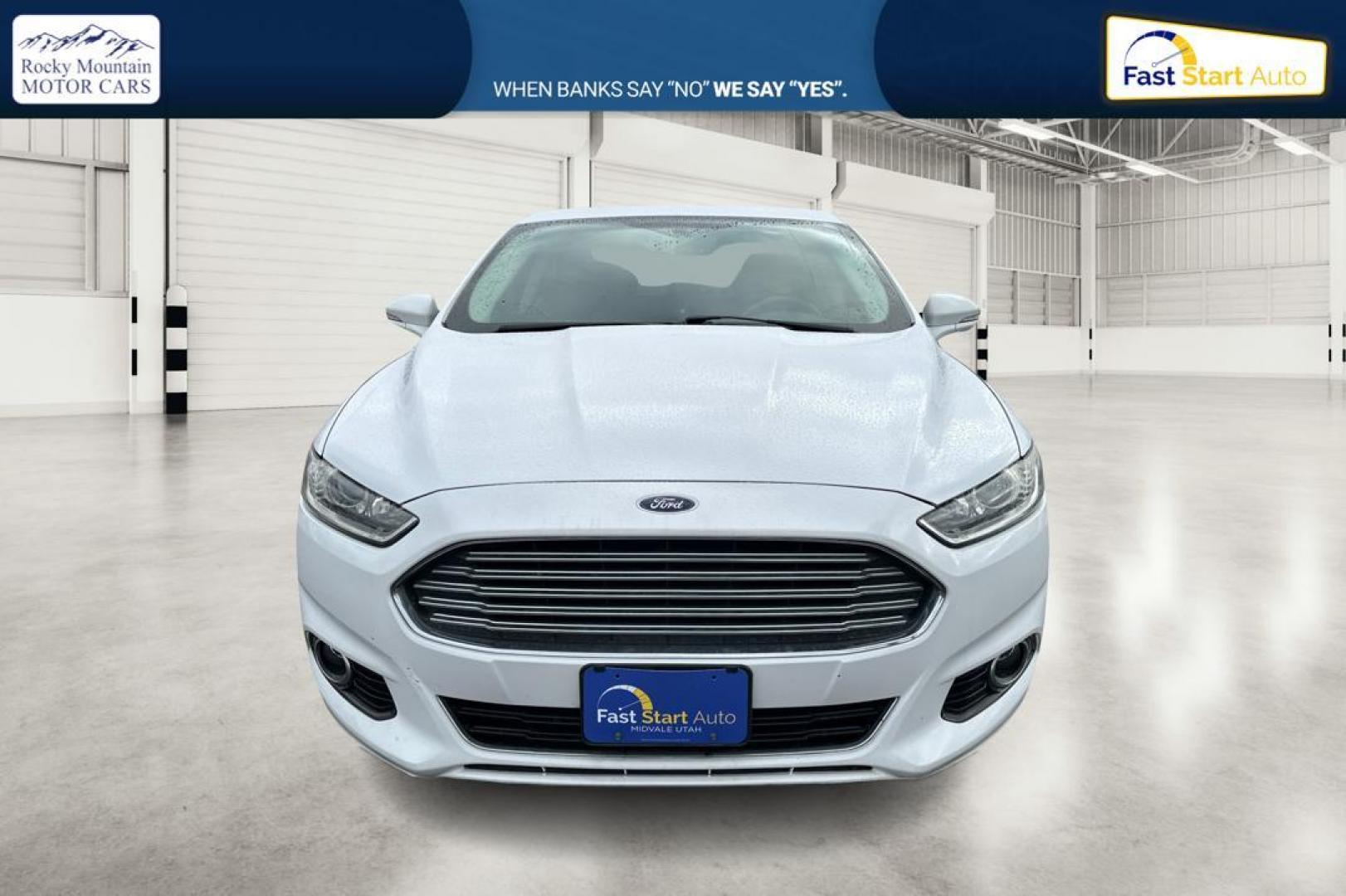 2014 White Ford Fusion Titanium (3FA6P0K93ER) with an 2.0L L4 DOHC 16V engine, Automatic, 6-Spd transmission, located at 7755 State Street, Midvale, UT, 84047, (801) 753-9063, 40.610329, -111.890656 - Photo#9