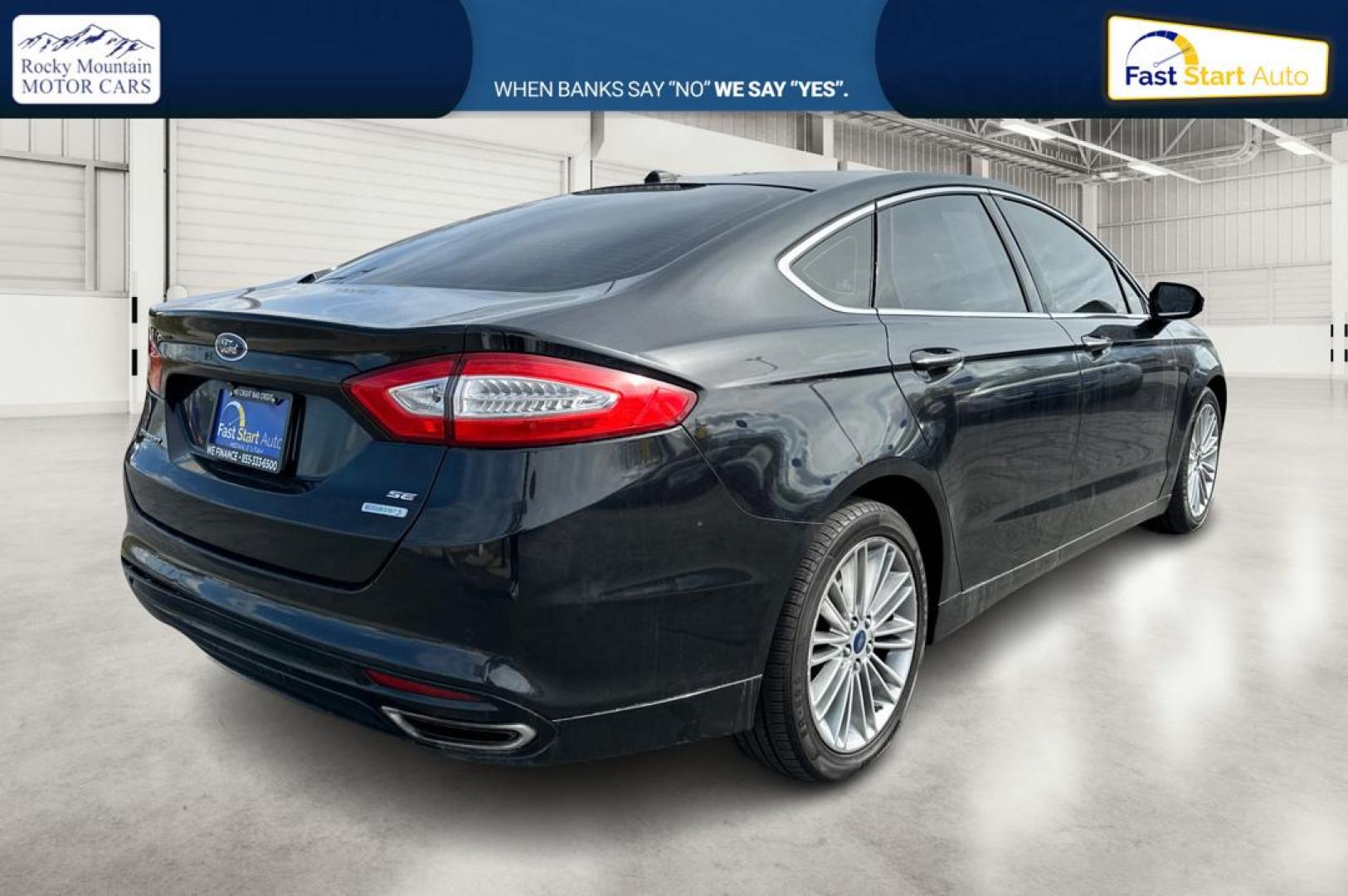 2014 Black Ford Fusion SE (3FA6P0H94ER) with an 2.0L L4 DOHC 16V engine, Automatic, 6-Spd transmission, located at 767 S State Road, Pleasant Grove, UT, 84062, (801) 785-1058, 40.354839, -111.736687 - Photo#2