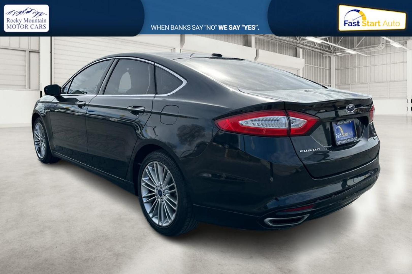 2014 Black Ford Fusion SE (3FA6P0H94ER) with an 2.0L L4 DOHC 16V engine, Automatic, 6-Spd transmission, located at 767 S State Road, Pleasant Grove, UT, 84062, (801) 785-1058, 40.354839, -111.736687 - Photo#5
