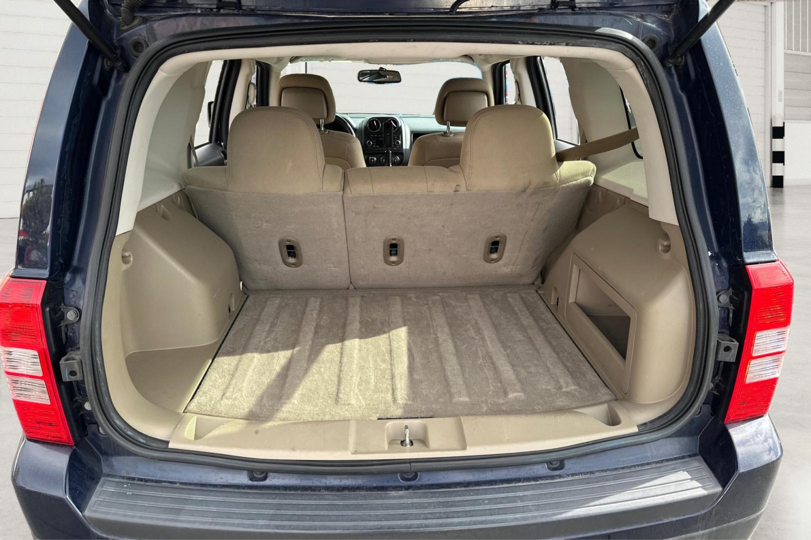 2014 Blue Jeep Patriot Latitude 2WD (1C4NJPFA5ED) with an 2.0L L4 DOHC 16V engine, Automatic, 6-Spd w/AutoStick transmission, located at 7755 State Street, Midvale, UT, 84047, (801) 753-9063, 40.610329, -111.890656 - Photo#13