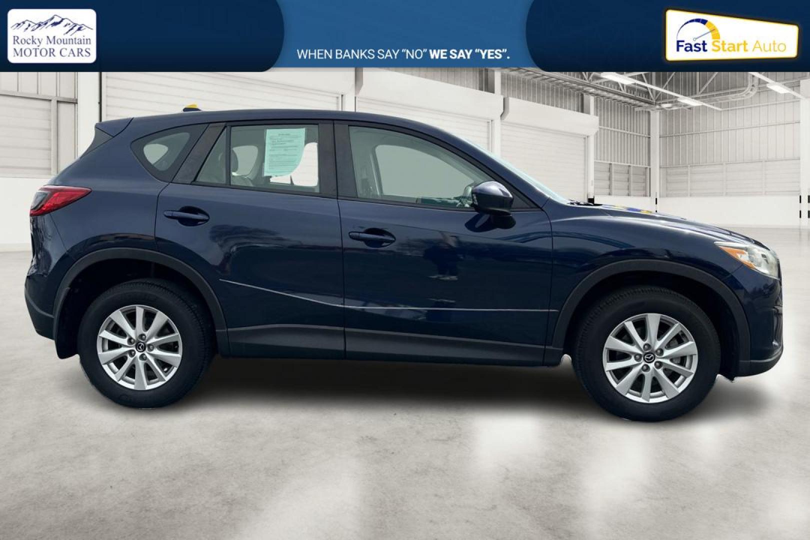 2014 Blue Mazda CX-5 Sport AT (JM3KE2BE7E0) with an 2.5L L4 DOHC 16V engine, 6-Speed Automatic transmission, located at 767 S State Road, Pleasant Grove, UT, 84062, (801) 785-1058, 40.354839, -111.736687 - Photo#1