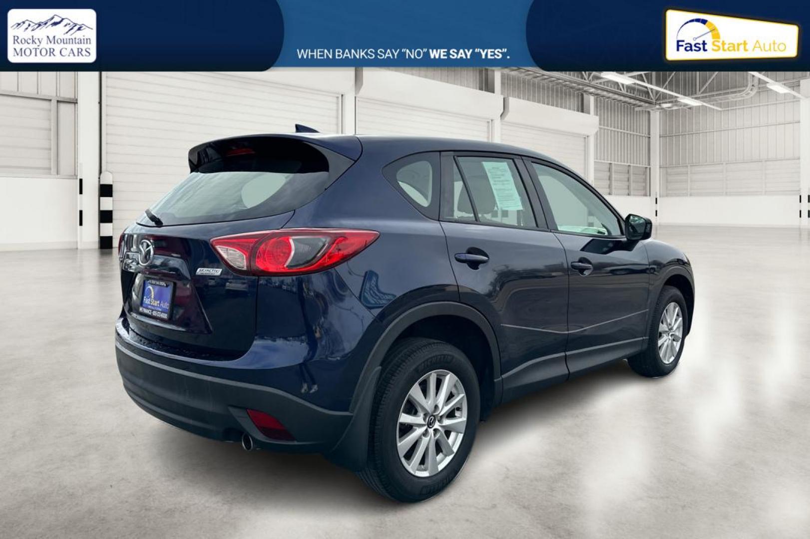 2014 Blue Mazda CX-5 Sport AT (JM3KE2BE7E0) with an 2.5L L4 DOHC 16V engine, 6-Speed Automatic transmission, located at 767 S State Road, Pleasant Grove, UT, 84062, (801) 785-1058, 40.354839, -111.736687 - Photo#2