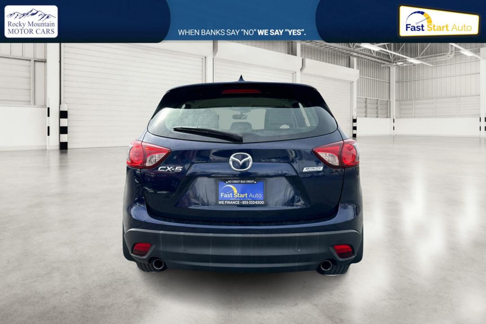 2014 Blue Mazda CX-5 Sport AT (JM3KE2BE7E0) with an 2.5L L4 DOHC 16V engine, 6-Speed Automatic transmission, located at 767 S State Road, Pleasant Grove, UT, 84062, (801) 785-1058, 40.354839, -111.736687 - Photo#4
