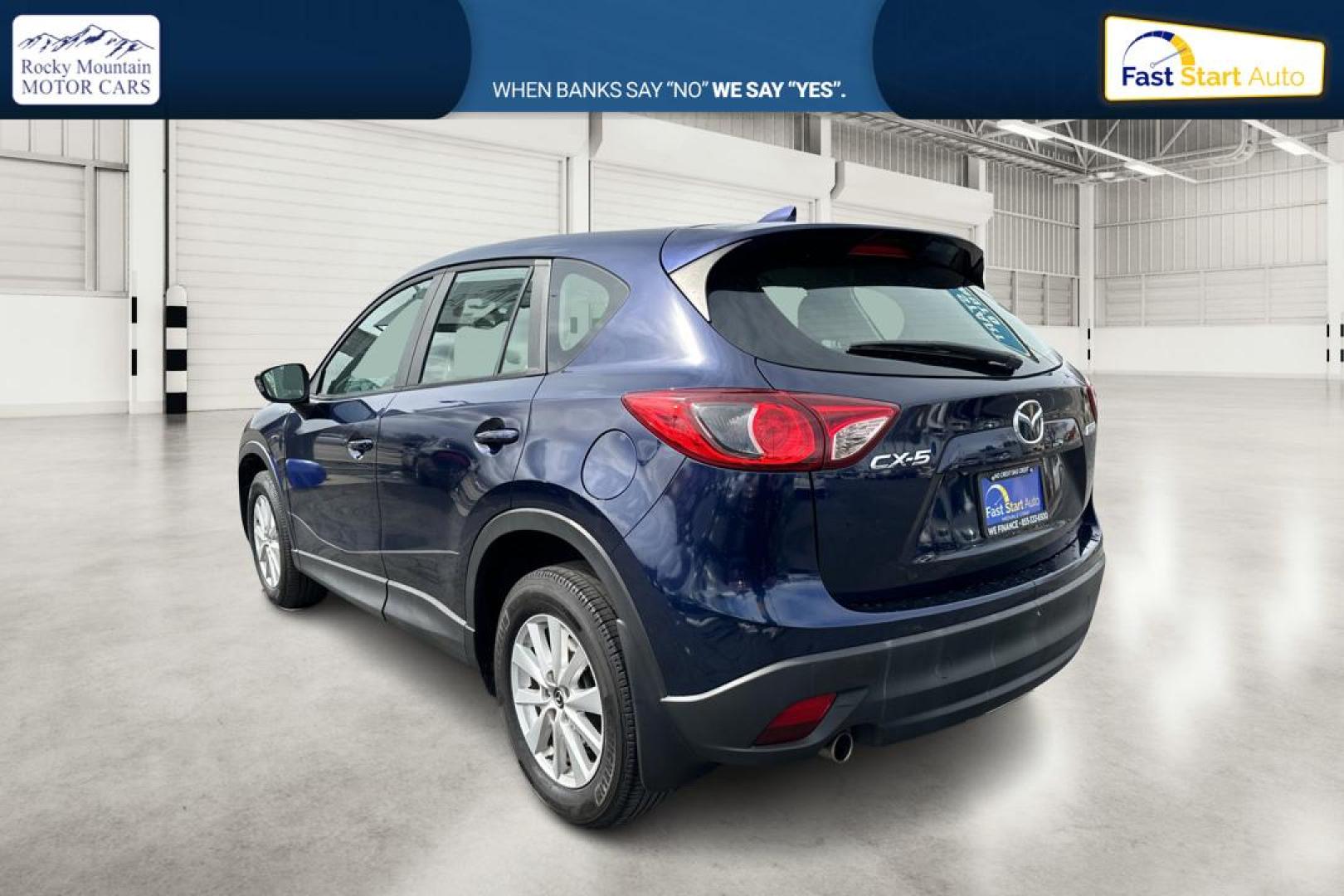 2014 Blue Mazda CX-5 Sport AT (JM3KE2BE7E0) with an 2.5L L4 DOHC 16V engine, 6-Speed Automatic transmission, located at 767 S State Road, Pleasant Grove, UT, 84062, (801) 785-1058, 40.354839, -111.736687 - Photo#5