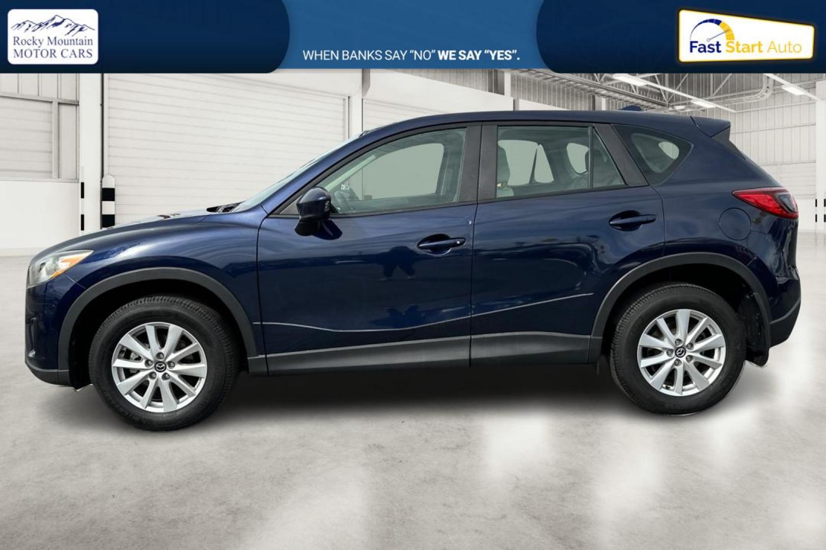 2014 Blue Mazda CX-5 Sport AT (JM3KE2BE7E0) with an 2.5L L4 DOHC 16V engine, 6-Speed Automatic transmission, located at 767 S State Road, Pleasant Grove, UT, 84062, (801) 785-1058, 40.354839, -111.736687 - Photo#6
