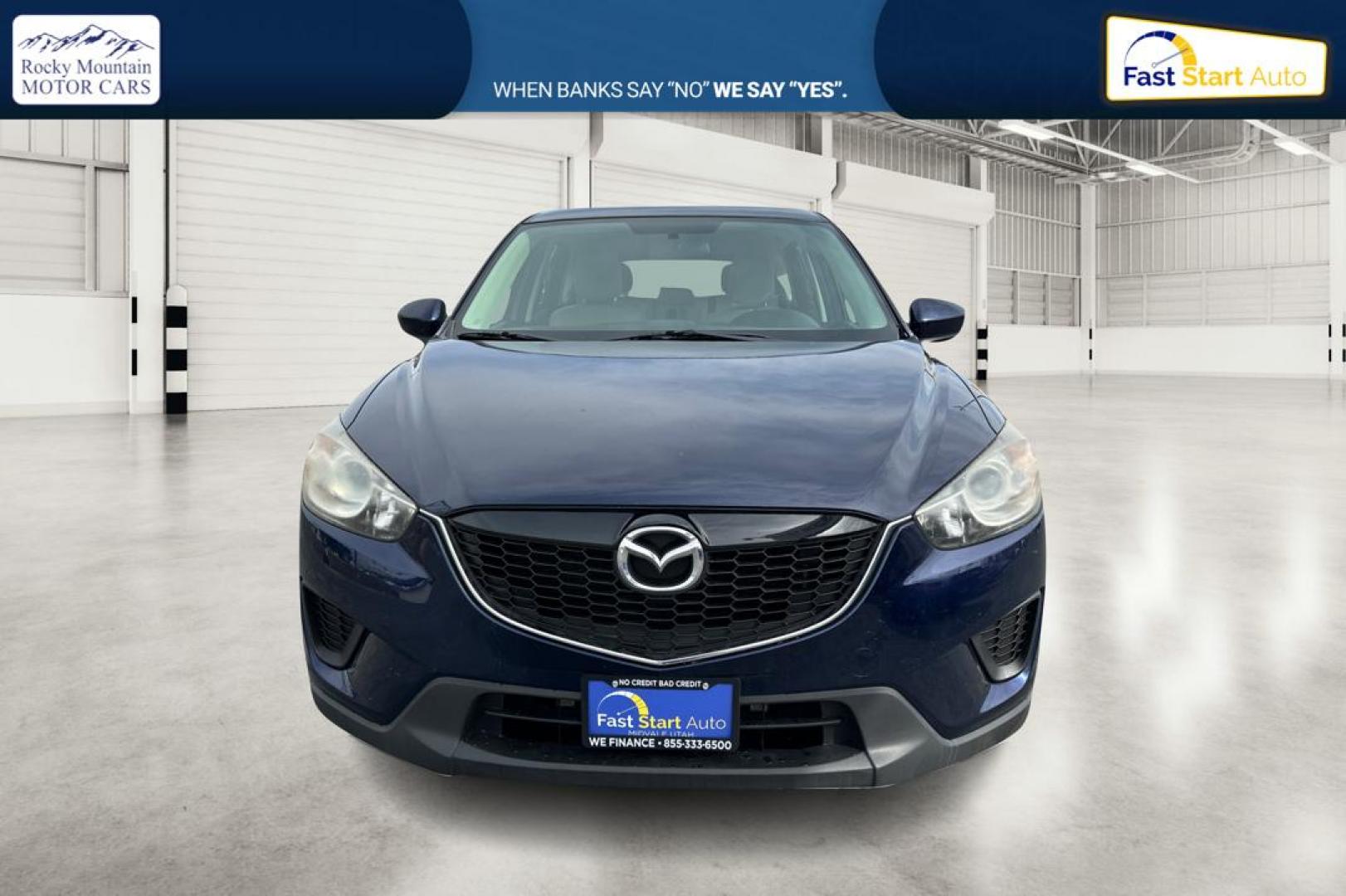2014 Blue Mazda CX-5 Sport AT (JM3KE2BE7E0) with an 2.5L L4 DOHC 16V engine, 6-Speed Automatic transmission, located at 767 S State Road, Pleasant Grove, UT, 84062, (801) 785-1058, 40.354839, -111.736687 - Photo#9