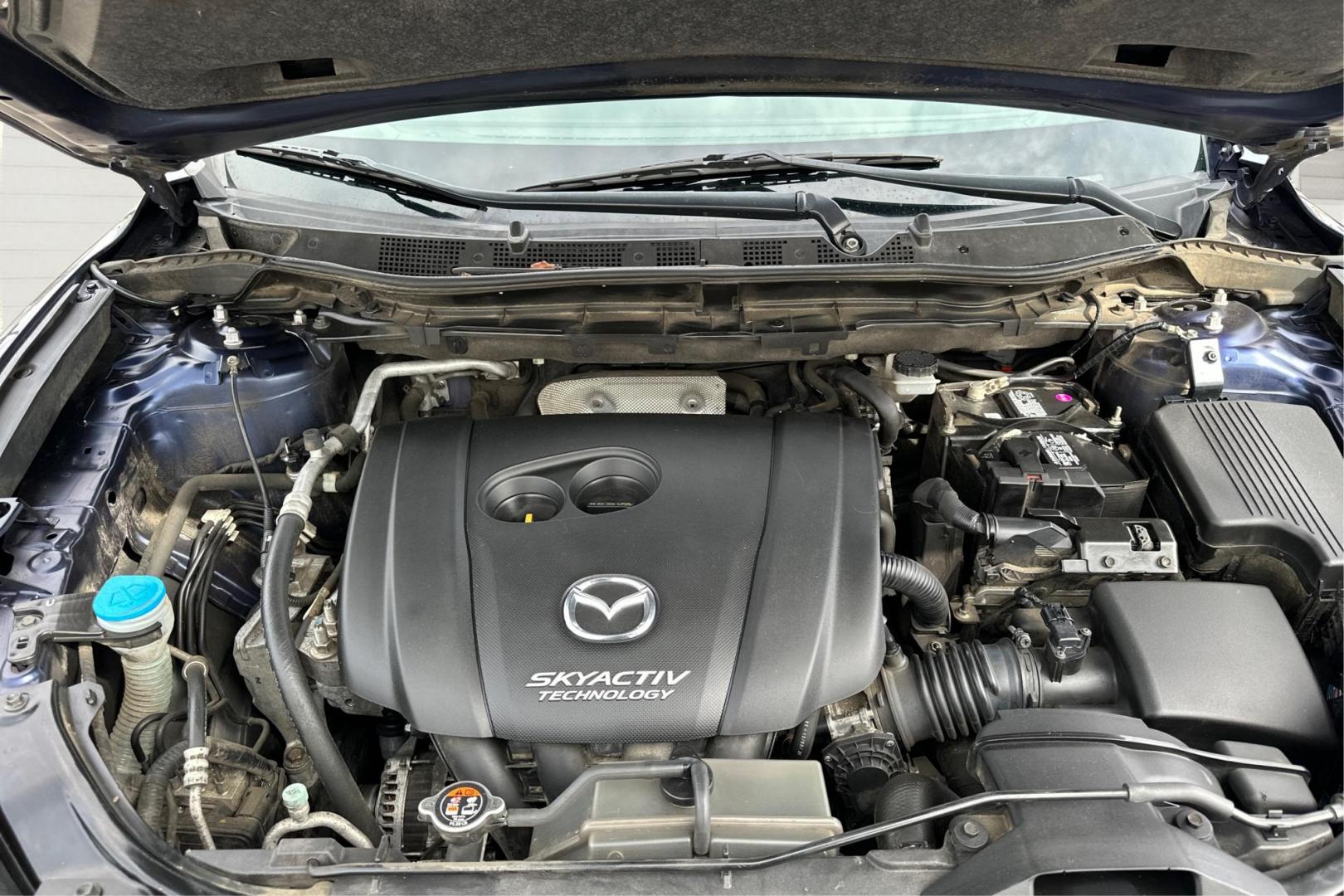 2014 Blue Mazda CX-5 Sport AT (JM3KE2BE7E0) with an 2.5L L4 DOHC 16V engine, 6-Speed Automatic transmission, located at 767 S State Road, Pleasant Grove, UT, 84062, (801) 785-1058, 40.354839, -111.736687 - Photo#10
