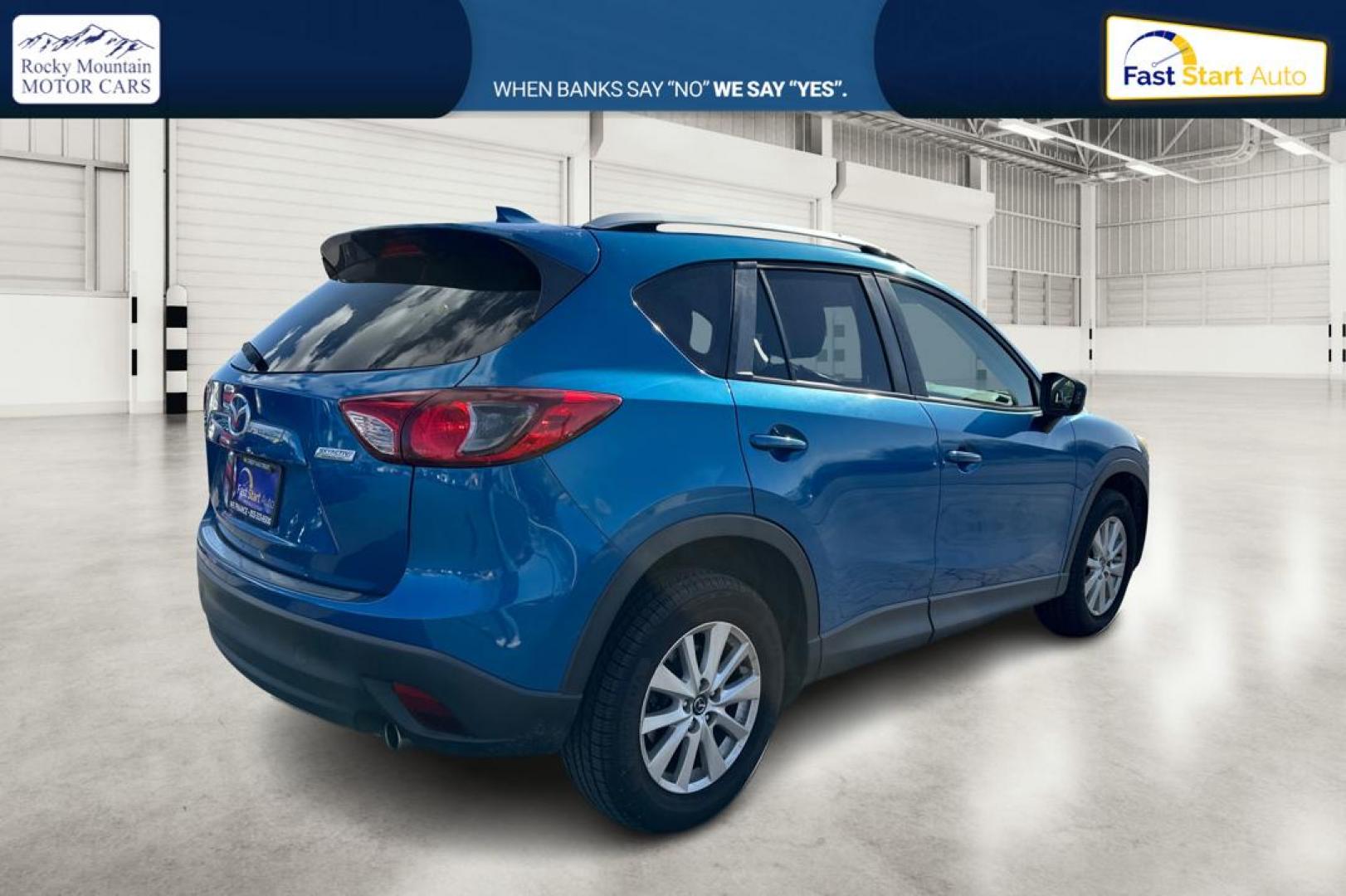 2014 Blue Mazda CX-5 Touring (JM3KE2CY1E0) with an 2.5L L4 DOHC 16V engine, 6-Speed Automatic transmission, located at 7755 State Street, Midvale, UT, 84047, (801) 753-9063, 40.610329, -111.890656 - Photo#2