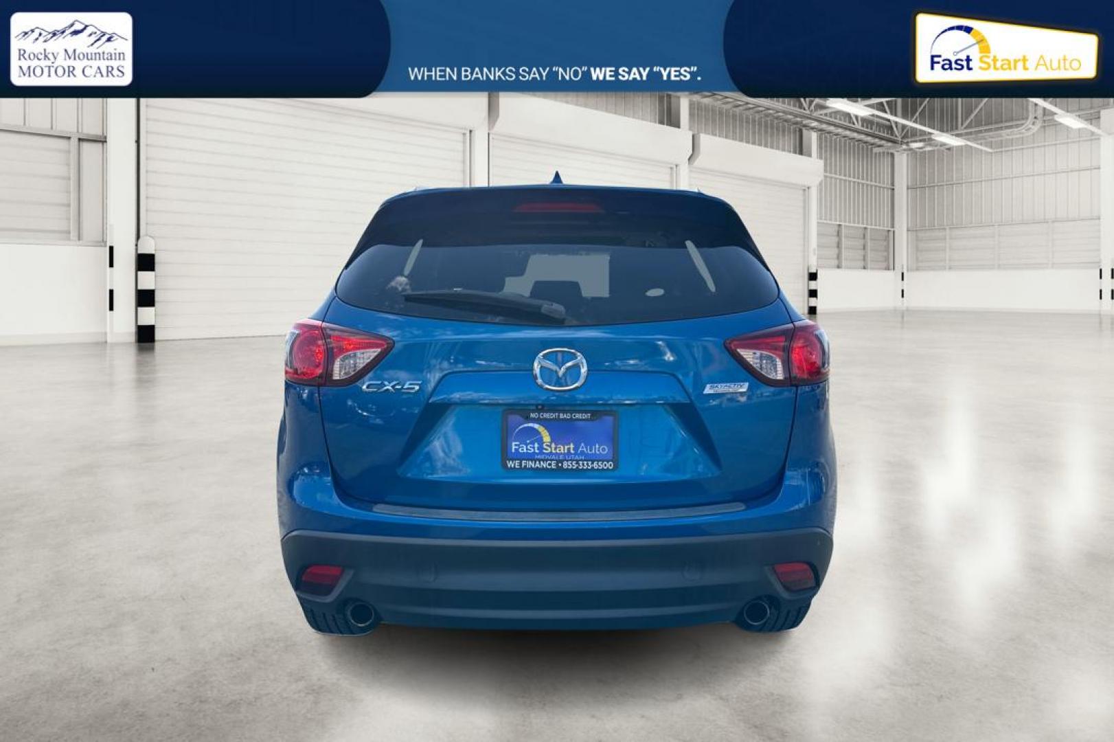 2014 Blue Mazda CX-5 Touring (JM3KE2CY1E0) with an 2.5L L4 DOHC 16V engine, 6-Speed Automatic transmission, located at 7755 State Street, Midvale, UT, 84047, (801) 753-9063, 40.610329, -111.890656 - Photo#4