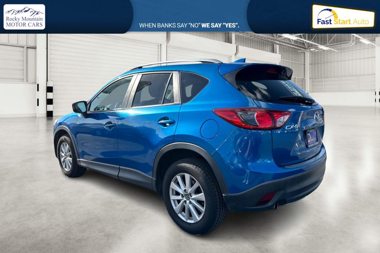 2014 Blue Mazda CX-5 Touring (JM3KE2CY1E0) with an 2.5L L4 DOHC 16V engine, 6-Speed Automatic transmission, located at 7755 State Street, Midvale, UT, 84047, (801) 753-9063, 40.610329, -111.890656 - Photo#5