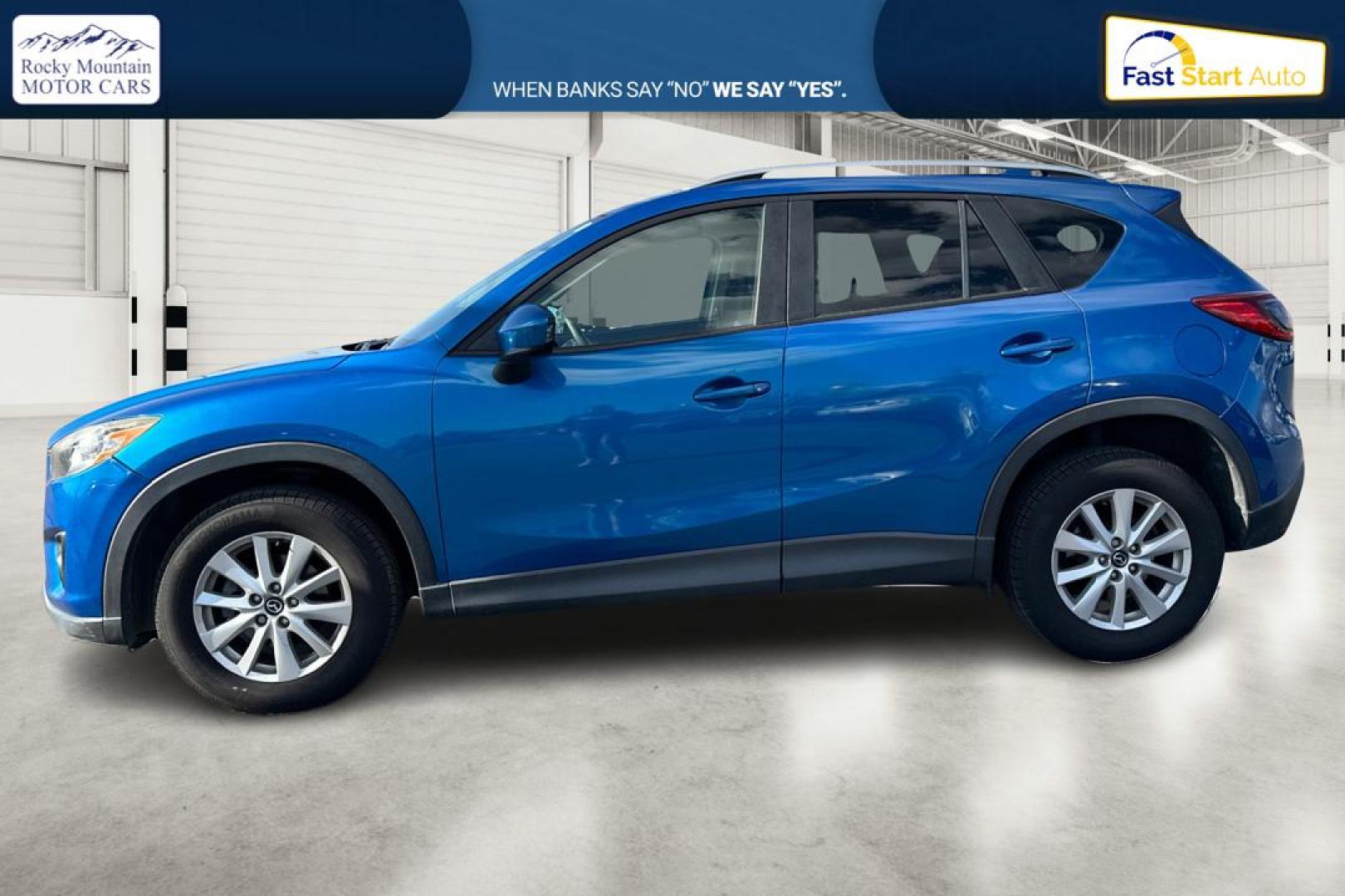 2014 Blue Mazda CX-5 Touring (JM3KE2CY1E0) with an 2.5L L4 DOHC 16V engine, 6-Speed Automatic transmission, located at 7755 State Street, Midvale, UT, 84047, (801) 753-9063, 40.610329, -111.890656 - Photo#6