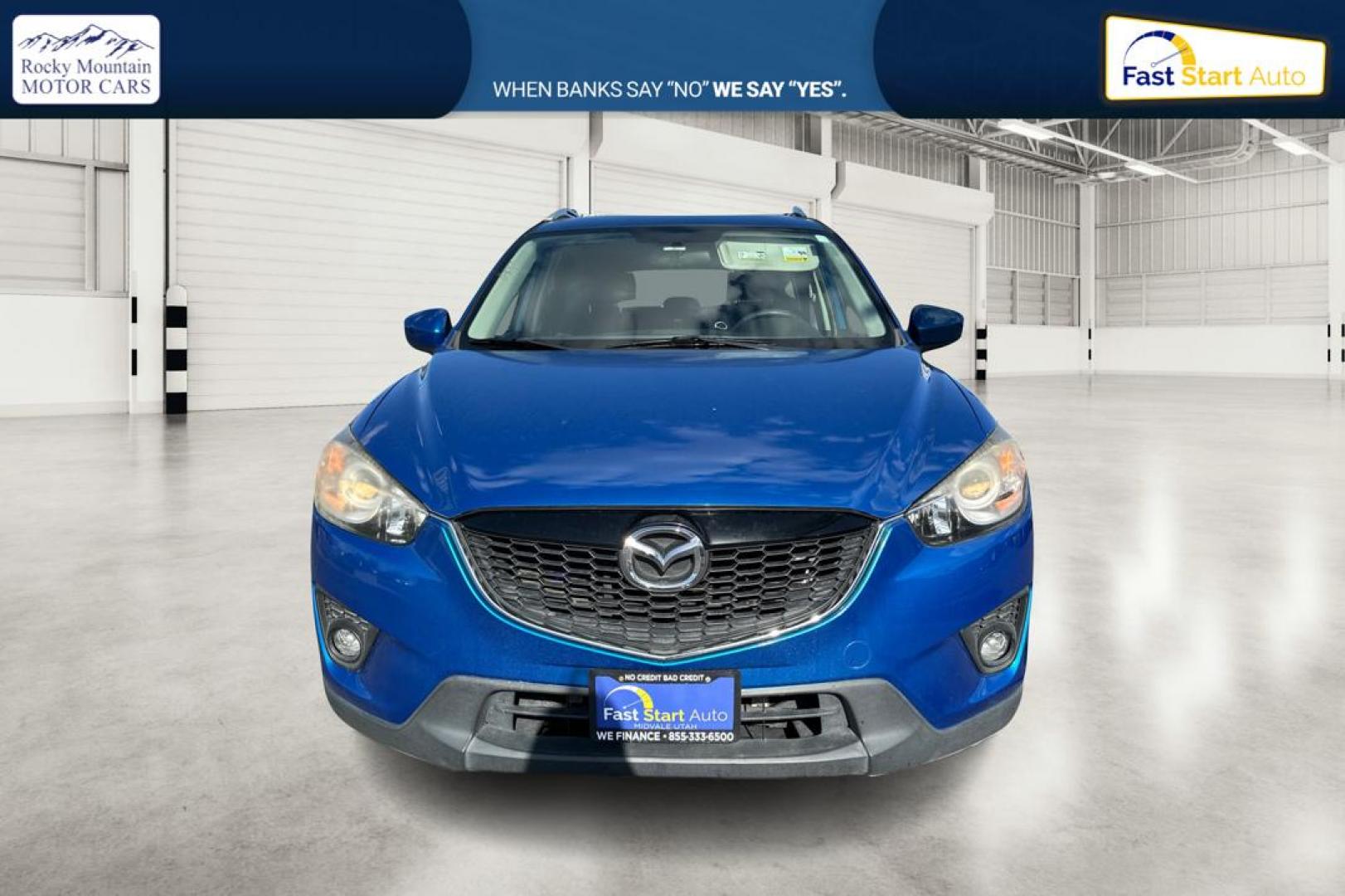 2014 Blue Mazda CX-5 Touring (JM3KE2CY1E0) with an 2.5L L4 DOHC 16V engine, 6-Speed Automatic transmission, located at 7755 State Street, Midvale, UT, 84047, (801) 753-9063, 40.610329, -111.890656 - Photo#9