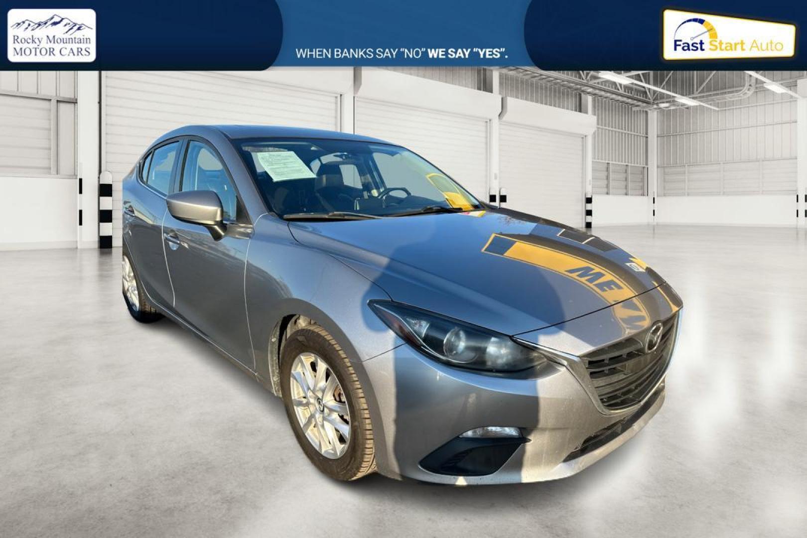 2014 Silver Mazda MAZDA3 i Grand Touring AT 4-Door (JM1BM1W76E1) with an 2.0L L4 DOHC 16V engine, 6-Speed Automatic transmission, located at 344 S Washington Blvd, Ogden, UT, 84404, (801) 399-1799, 41.255482, -111.970848 - Photo#0