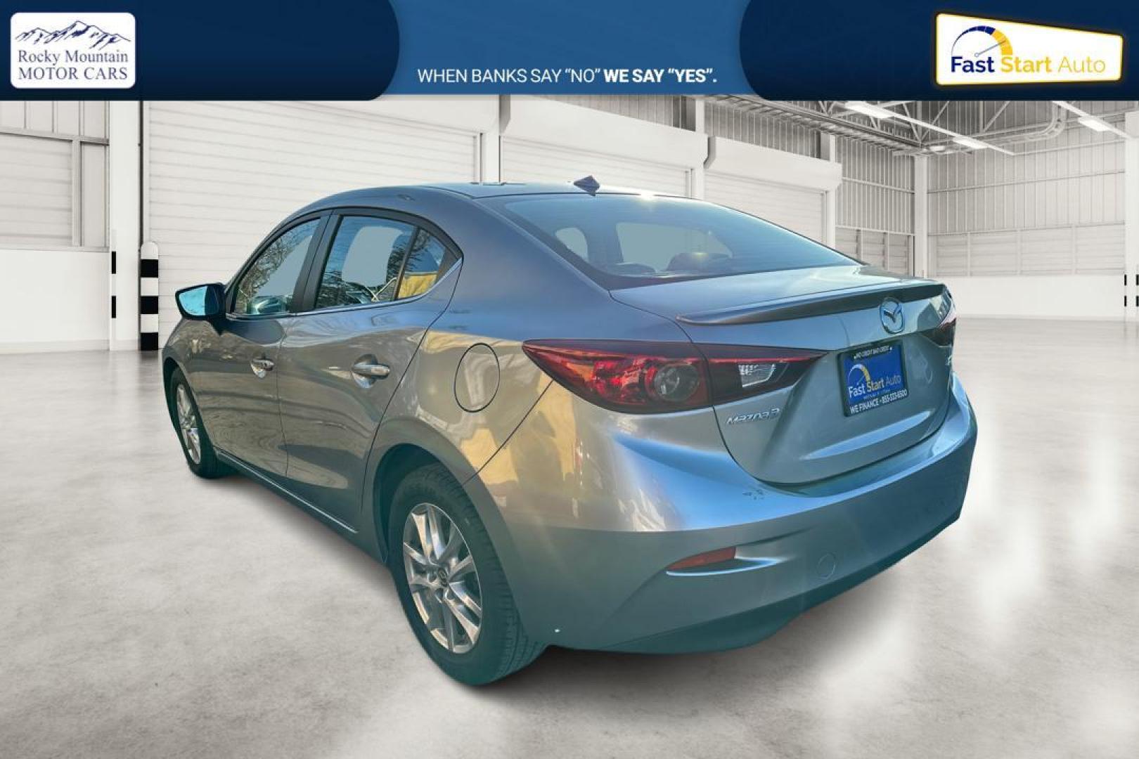 2014 Silver Mazda MAZDA3 i Grand Touring AT 4-Door (JM1BM1W76E1) with an 2.0L L4 DOHC 16V engine, 6-Speed Automatic transmission, located at 344 S Washington Blvd, Ogden, UT, 84404, (801) 399-1799, 41.255482, -111.970848 - Photo#4