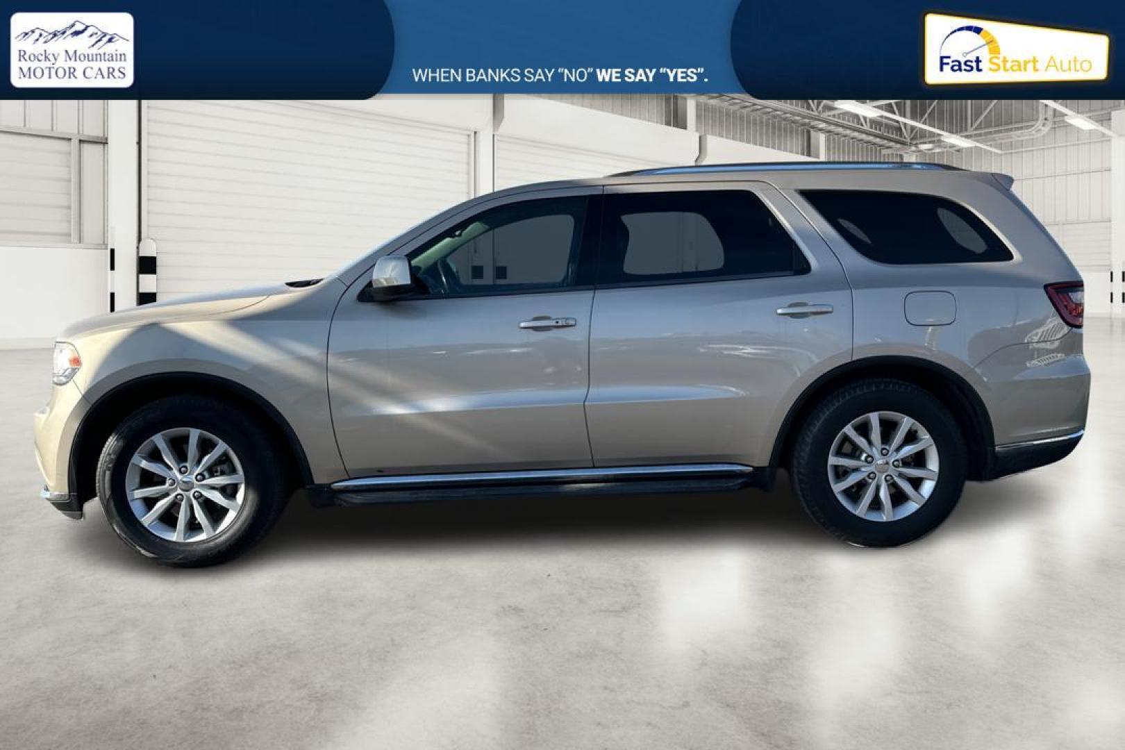 2015 Gold Dodge Durango SXT RWD (1C4RDHAG4FC) with an 3.6L V6 DOHC 24V engine, 8-Speed Automatic transmission, located at 7755 State Street, Midvale, UT, 84047, (801) 753-9063, 40.610329, -111.890656 - Photo#6