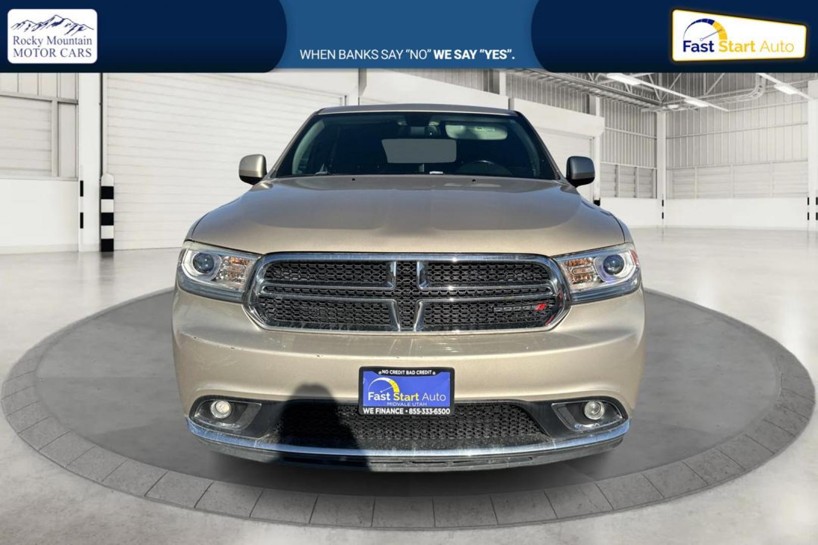 2015 Gold Dodge Durango SXT RWD (1C4RDHAG4FC) with an 3.6L V6 DOHC 24V engine, 8-Speed Automatic transmission, located at 7755 State Street, Midvale, UT, 84047, (801) 753-9063, 40.610329, -111.890656 - Photo#7